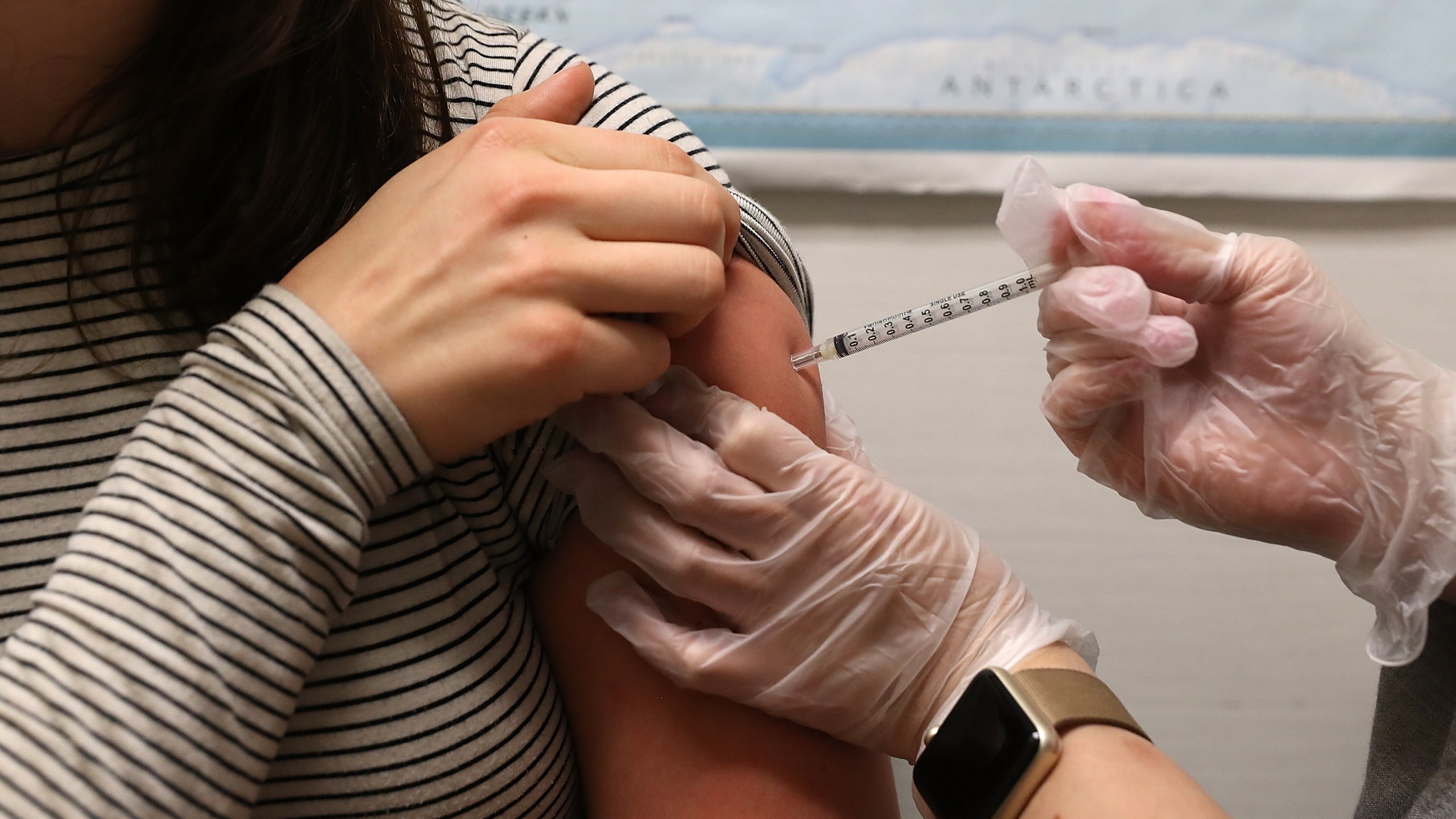 A woman receives a flu shot at a Walgreens pharmacy on January 22, 2018 in San Francisco. (Credit: Justin Sullivan/Getty Images)