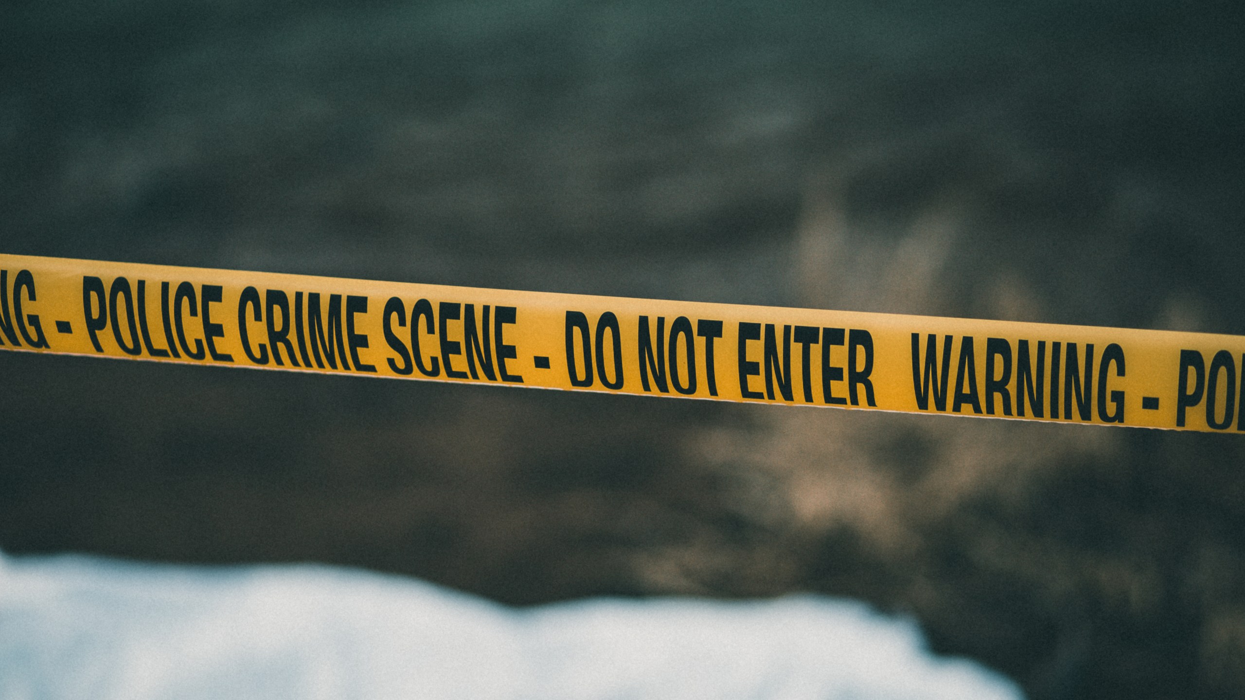 A crime scene with yellow police tape is shown in a file photo. (Credit: E+ via Getty Images)