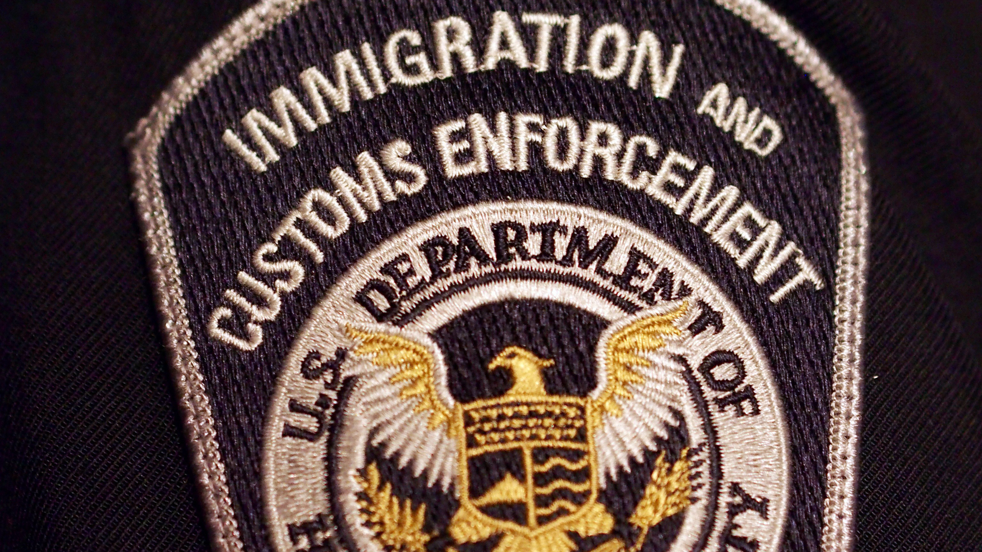 A U.S. Immigration and Customs Enforcement badge is seen in a file photo. (Credit: Robert MacPherson / AFP / Getty Images)