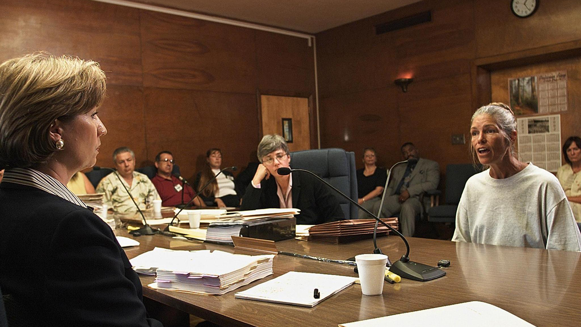 Sheron Lawin, left, a member of the Board of Prison Terms commissioners, listens to Leslie Van Houten, right, after her parole was denied June 28, 2002, at the California Institution for Women in Corona. (Credit: DAMIAN DOVARGANES/AFP/Getty Images)