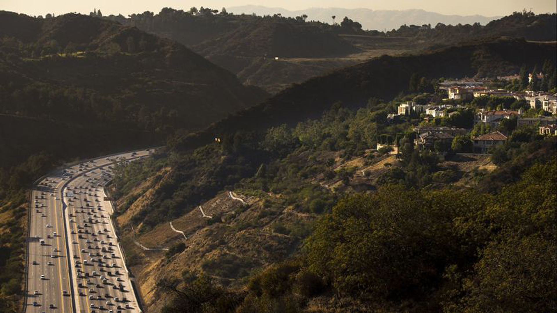 Traffic streams through the Sepulveda Pass, one of Southern California's most infamous bottlenecks. Metro says a new rail line could whisk commuters through the mountains and into West L.A. in as little as 15 minutes. (Credit: Kent Nishimura / Los Angeles Times)