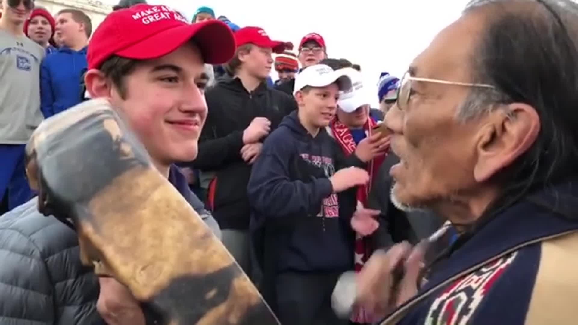 A crowd of teenagers surrounded a Native American elder and other activists and mocked them after Friday's Indigenous Peoples March at the Lincoln Memorial. (Credit: CNN)