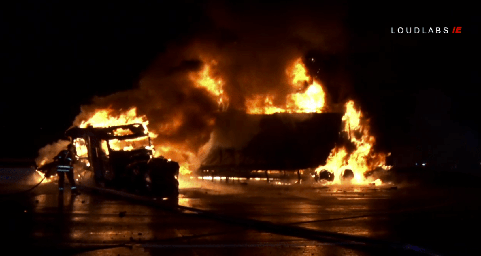 Firefighters work to put out a big rig on fire on the 10 Freeway in Colton following a collision on Jan. 15, 2019. (Credit: Loudlabs)