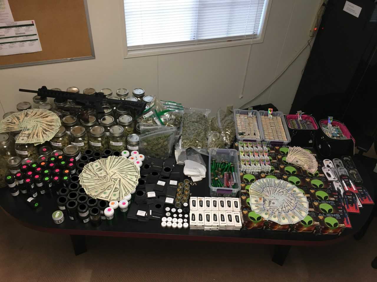 The Santa Barbara County Sheriff's Department seized about $60,000 worth of marijuana products, $7,600 in cash, and two unlicensed firearms involved in an illegal cannabis delivery service on Friday. (Credit: Santa Barbara County Sheriff's Department)