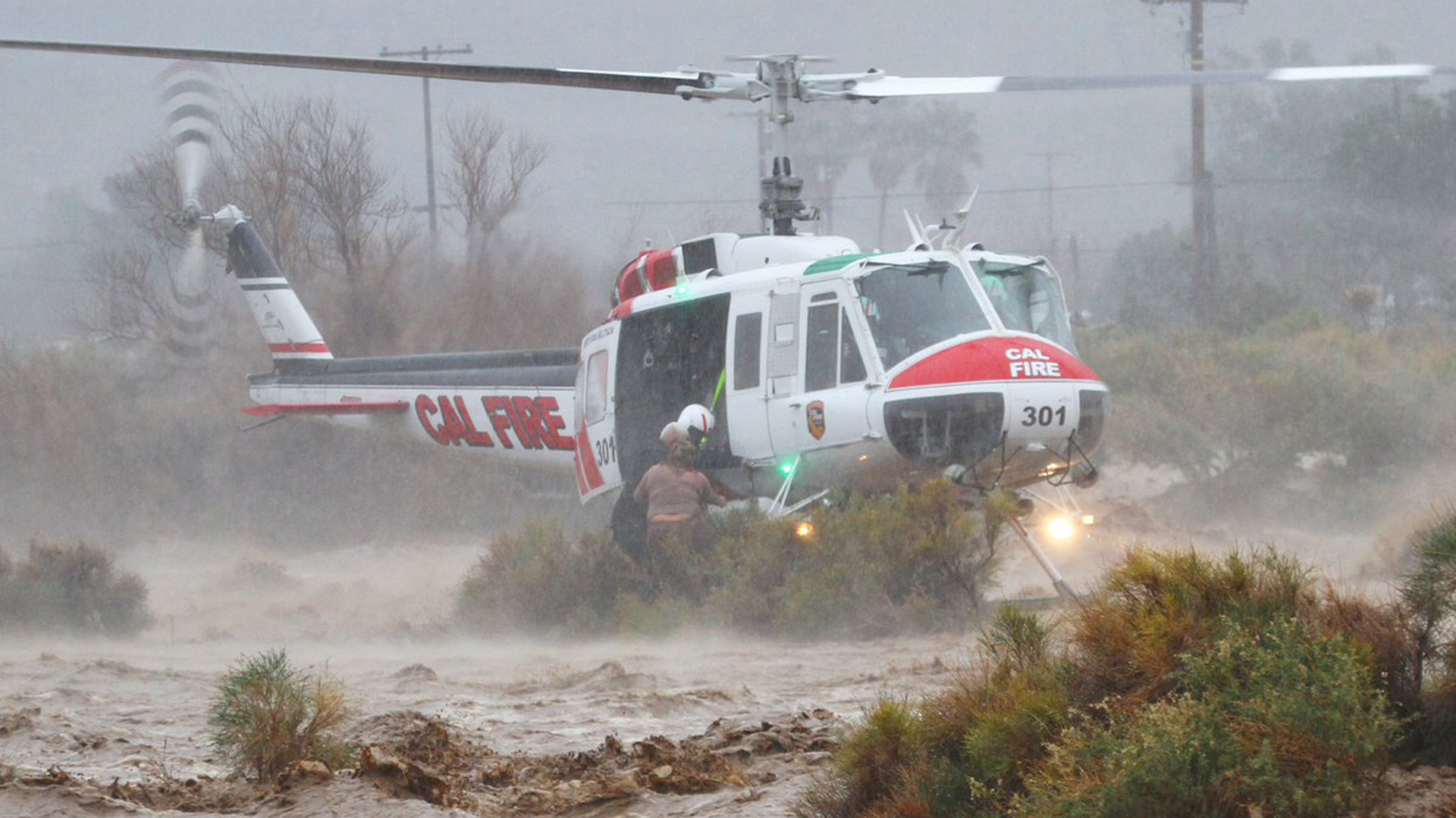 A Cal Fire helicopter works to rescue to people from flooding in Cabazon on Feb. 14, 2019. It was one of dozens of rescues carried out that day.(Credit: Cal Fire Riverside)