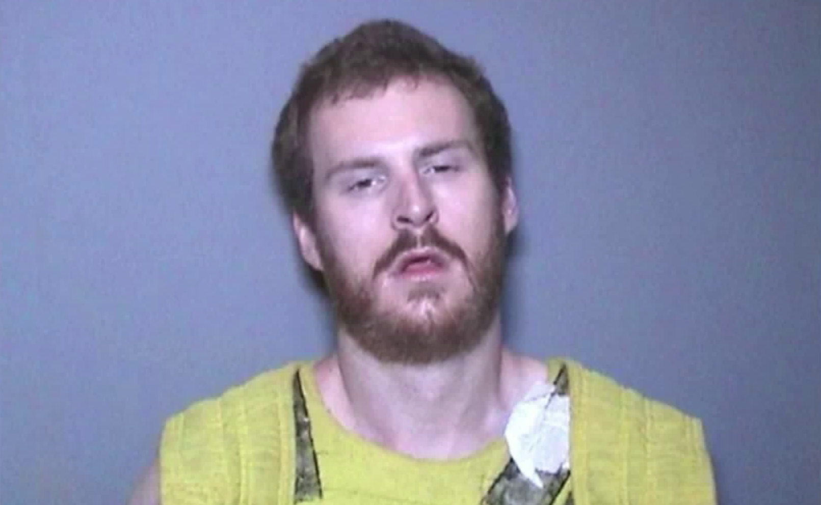 Camden Burton Nicholson, 27, is seen in a booking photo obtained by KTLA.