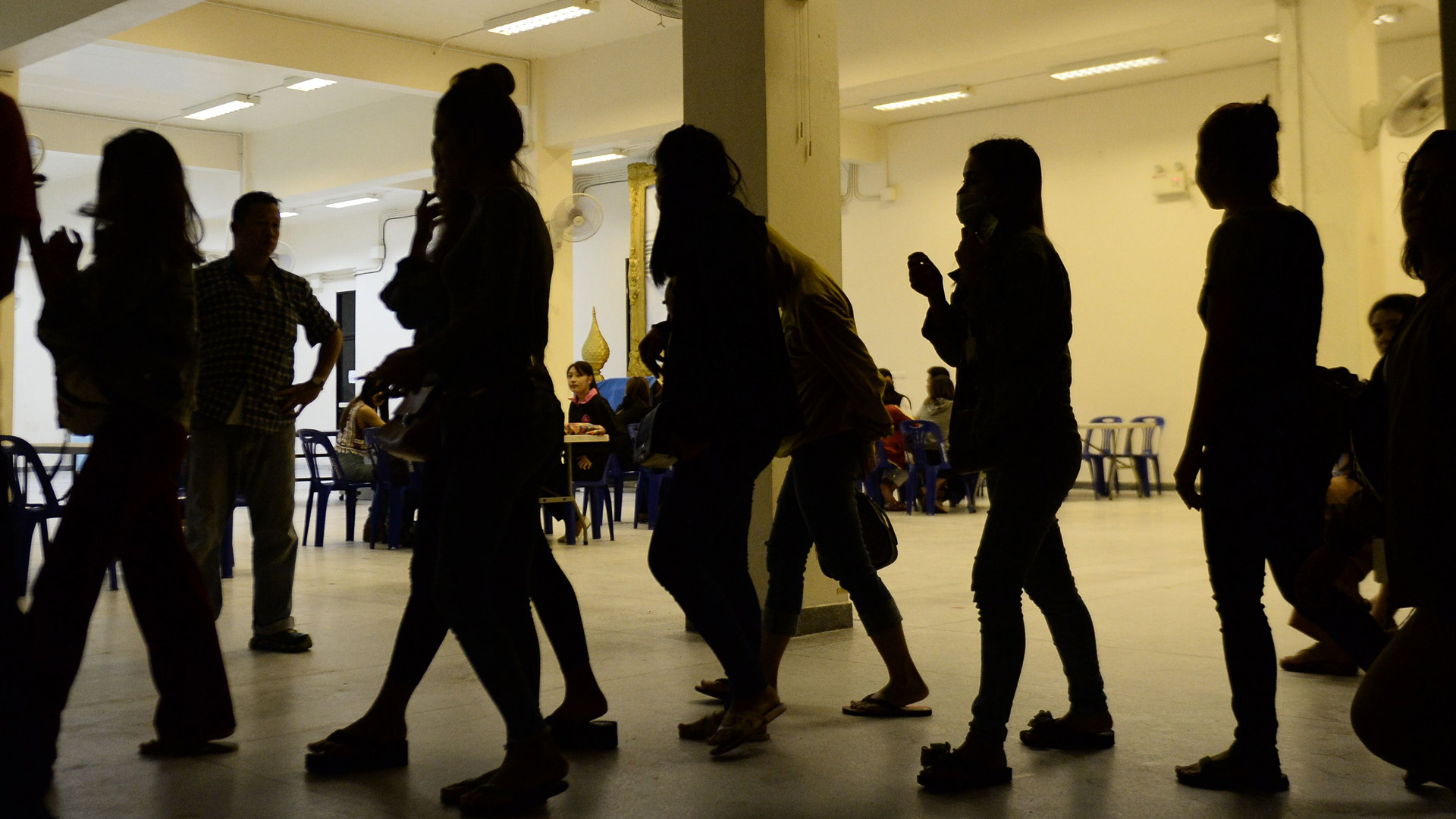 A group of foreign women rounded up by police from karaoke bars in Thailand's southern province of Narathiwat are taken to city hall during a campaign against prostitution and human trafficking involving women and minors on November 9, 2018. (Credit: MADAREE TOHLALA/AFP/Getty Images)