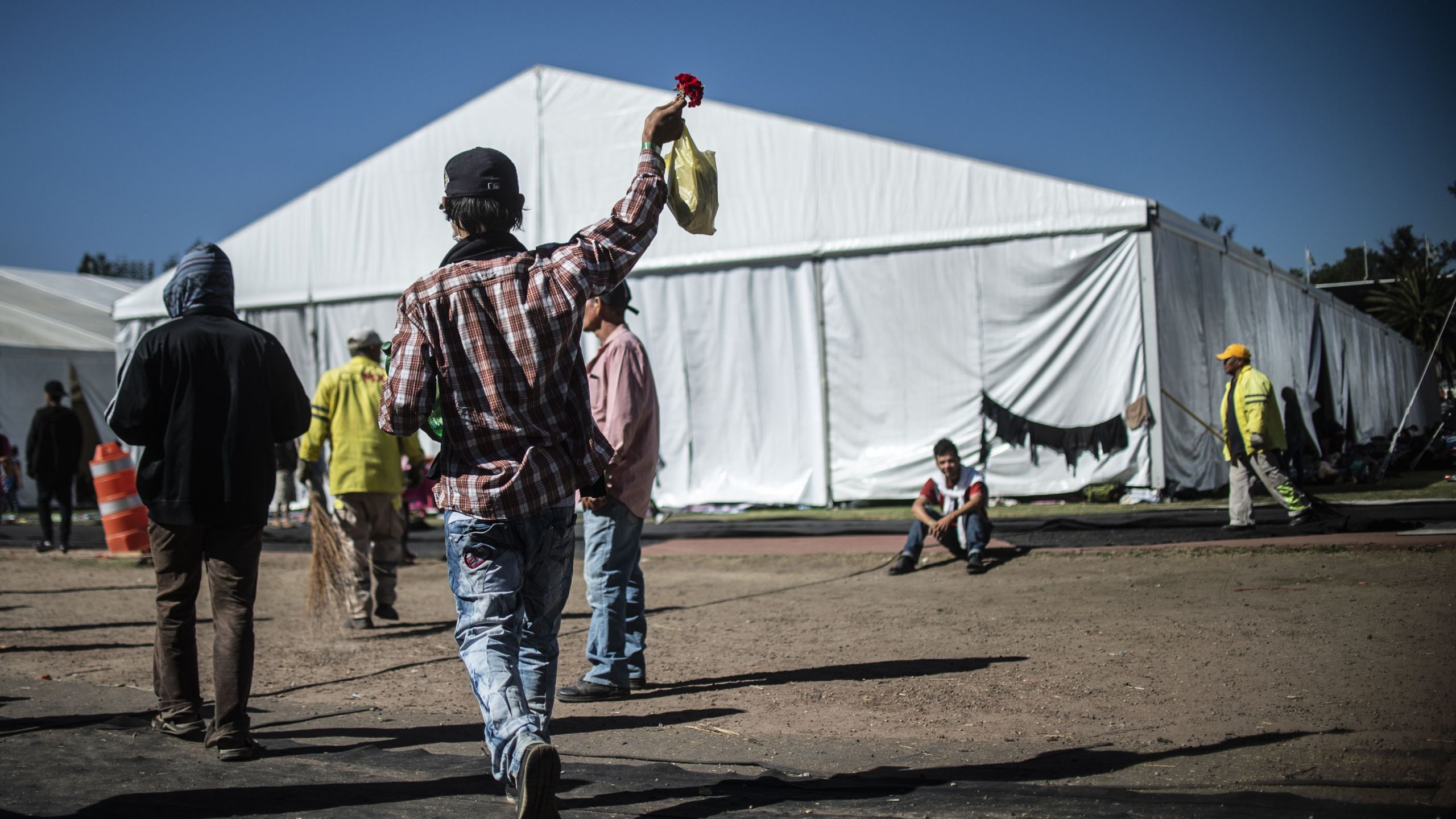 Central American migrants, mostly Hondurans, take part in a caravan heading towards the U.S., staying in a shelter set up at the Sports City in Mexico City on Jan. 30, 2019.(Credit: PEDRO PARDO/AFP/Getty Images)