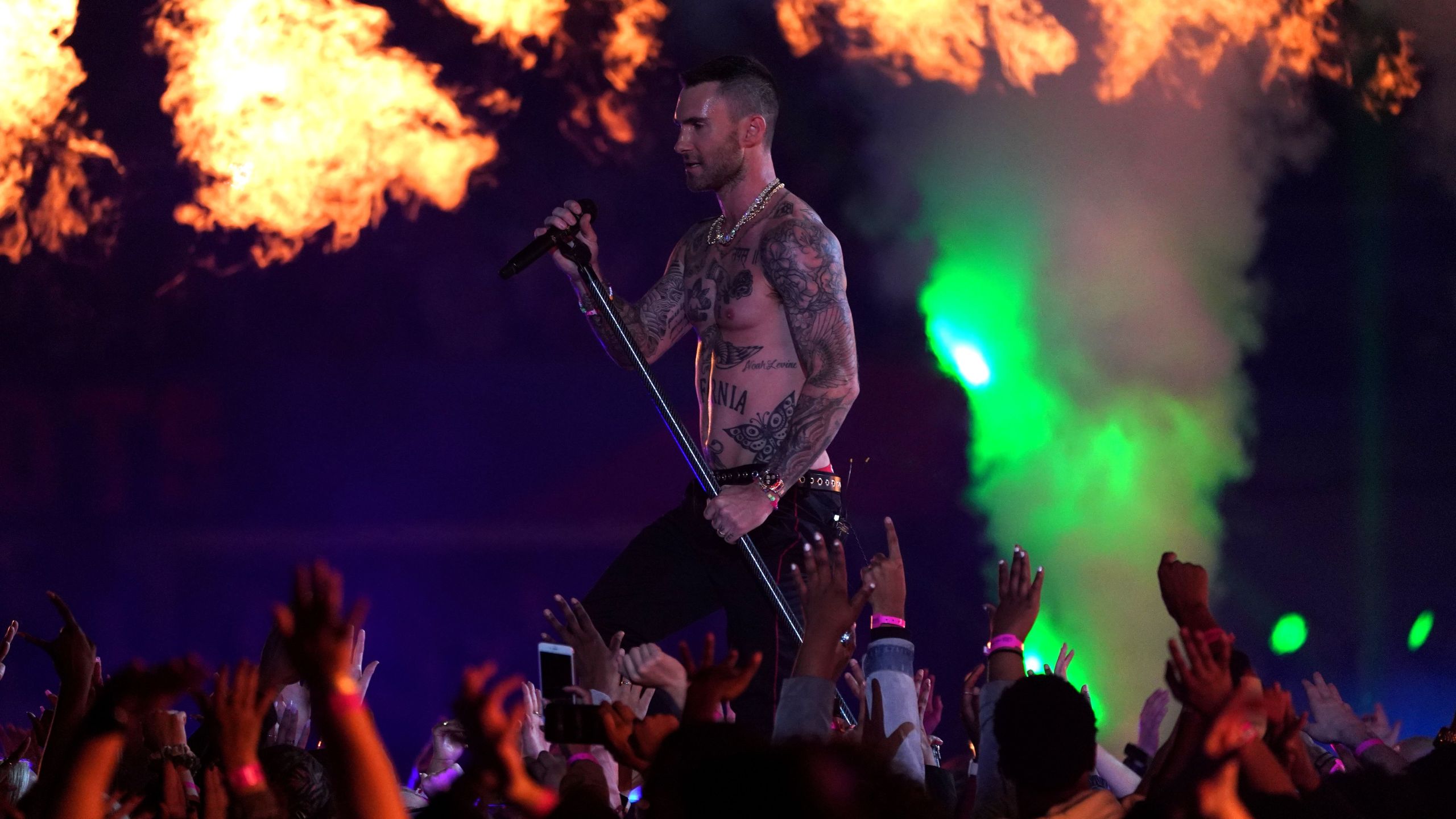 Lead vocalist of Maroon 5 Adam Levine performs during the halftime show of Super Bowl LIII between the New England Patriots and the Los Angeles Rams at Mercedes-Benz Stadium in Atlanta, Georgia, on February 3, 2019. (Credit: TIMOTHY A. CLARY/AFP/Getty Images)