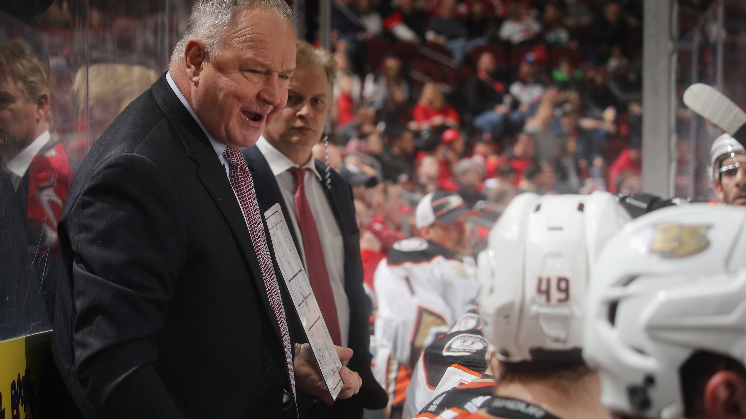 Randy Carlyle of the Anaheim Ducks handles bench duties during the first period against the New Jersey Devils at the Prudential Center on Jan. 19, 2019 in Newark, New Jersey. (Credit: Bruce Bennett/Getty Images)