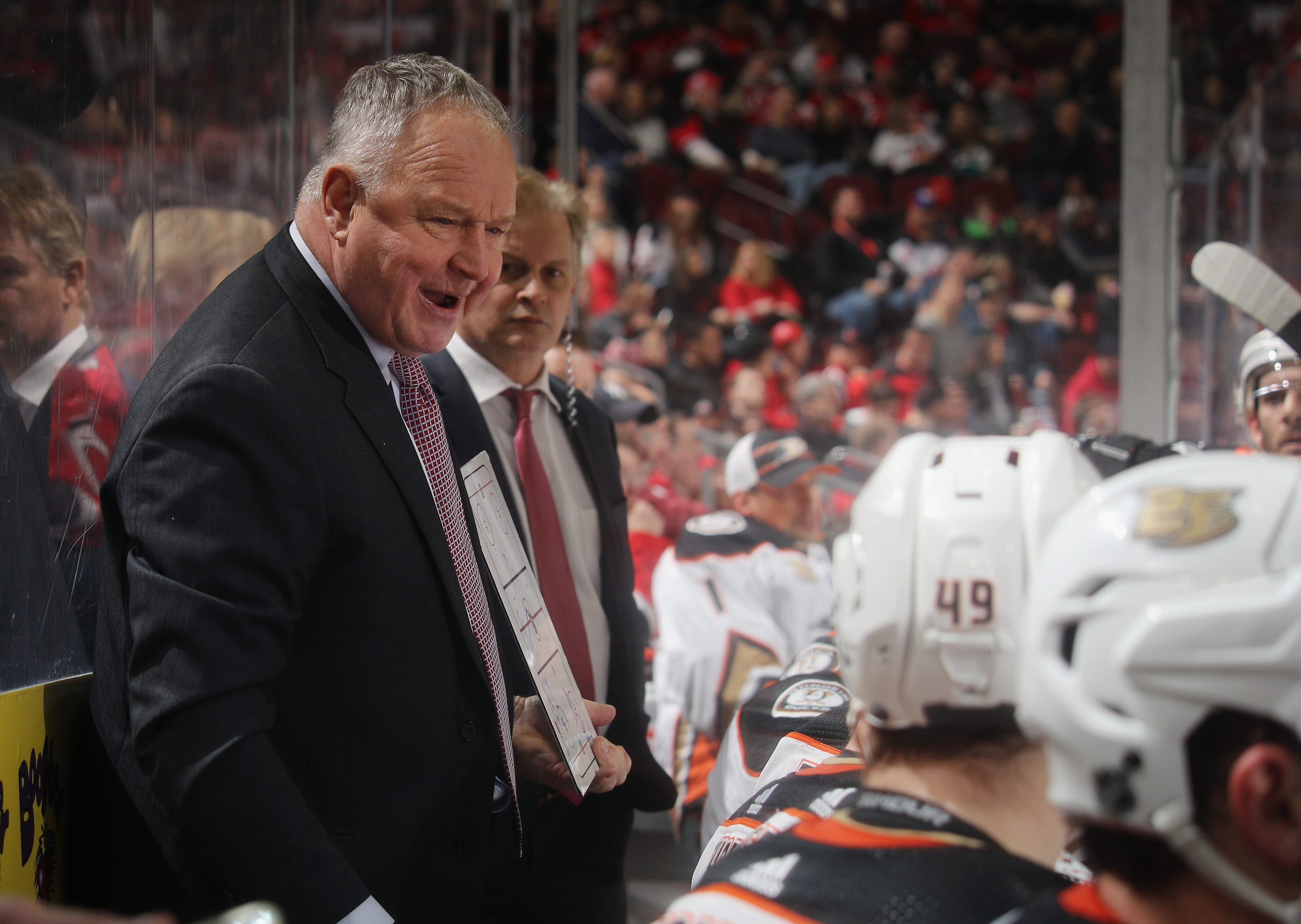 Randy Carlyle of the Anaheim Ducks handles bench duties during the first period against the New Jersey Devils at the Prudential Center on Jan. 19, 2019 in Newark, New Jersey. (Credit: Bruce Bennett/Getty Images)