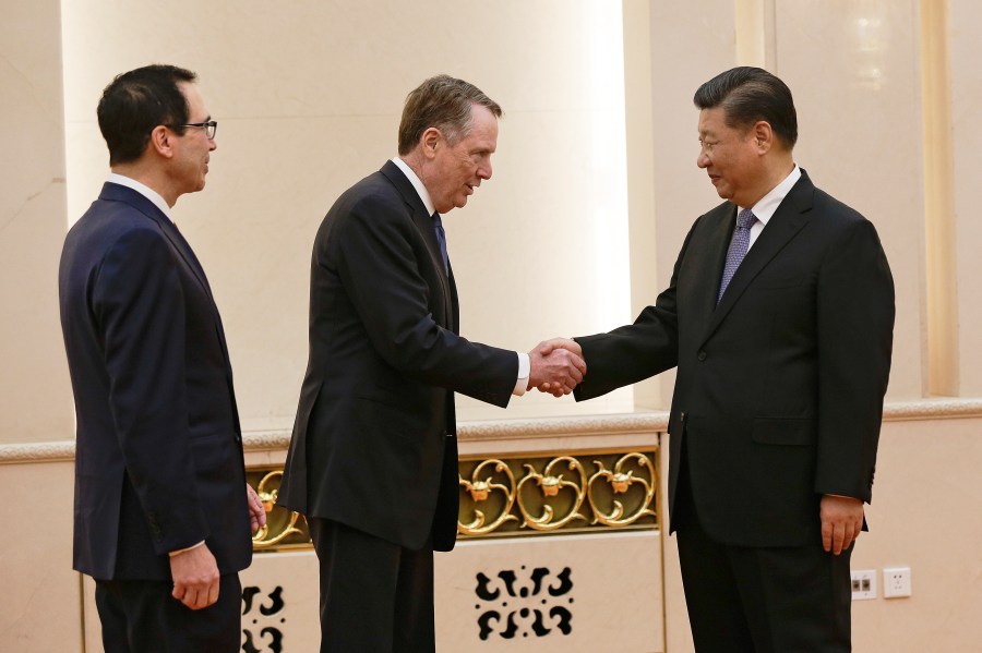 US Trade Representative Robert Lighthizer (C) shakes hands with Chinese President Xi Jinping next to US Treasury Secretary Steven Mnuchin (L) before proceeding to their meeting at the Great Hall of the People in Beijing on February 15, 2019. (Credit: ANDY WONG/AFP/Getty Images)