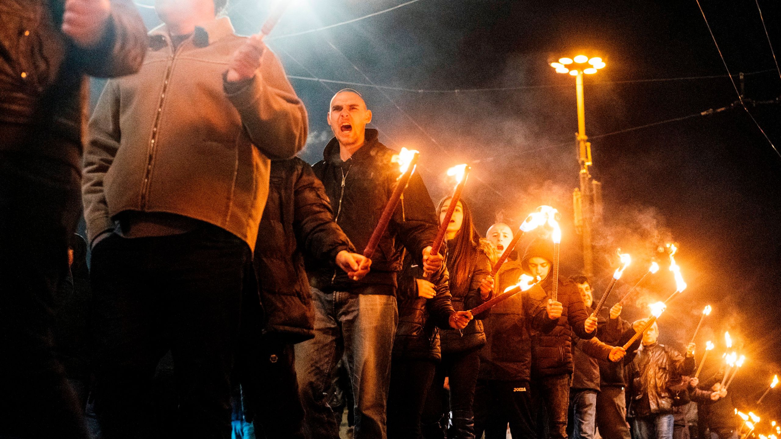 Members of nationalist organizations parade with torches during a march to commemorate Bulgarian General and politician Hristo Lukov, in the centre of Sofia on February 16, 2019. (Credit: DIMITAR DILKOFF/AFP/Getty Images)