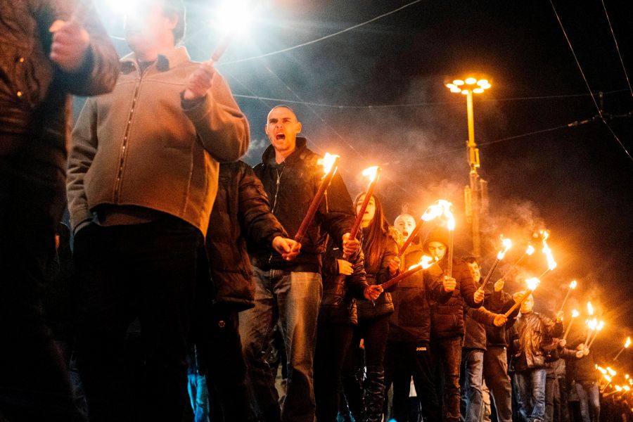 Members of nationalist organizations parade with torches during a march to commemorate Bulgarian General and politician Hristo Lukov, in the centre of Sofia on February 16, 2019. (Credit: DIMITAR DILKOFF/AFP/Getty Images)