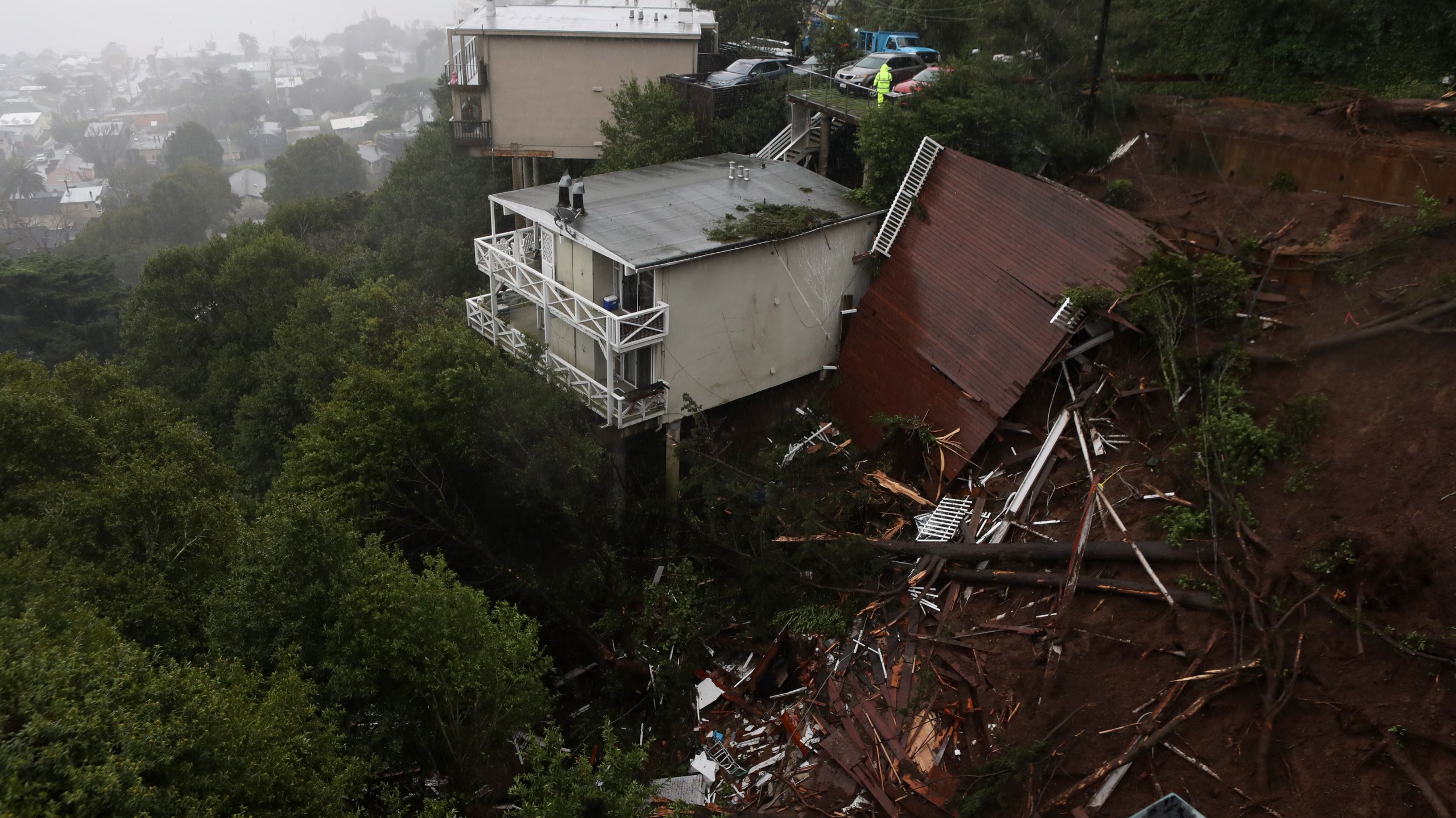 The roof of a home is seen after it was swept down a hill by a mudslide in Sausalito during a rain storm on Feb. 14, 2019. (Credit: Justin Sullivan / Getty Images)