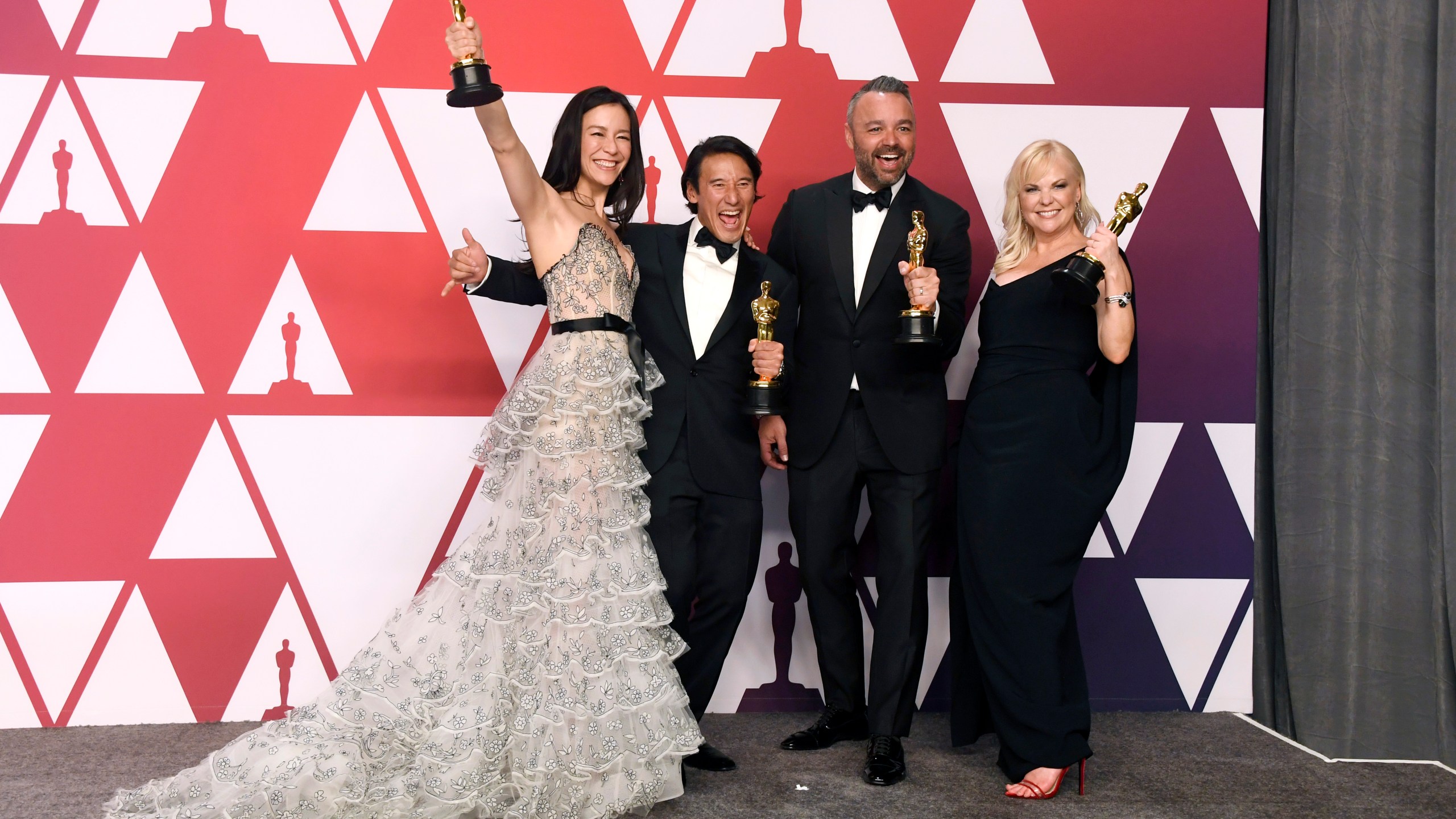 (L-R) Elizabeth Chai Vasarhelyi, Jimmy Chin, Evan Hayes, and Shannon Dill, winners of Best Documentary Feature for 'Free Solo,' pose in the press room during the 91st Annual Academy Awards at Hollywood and Highland on February 24, 2019 in Hollywood, California. (Credit: Frazer Harrison/Getty Images)