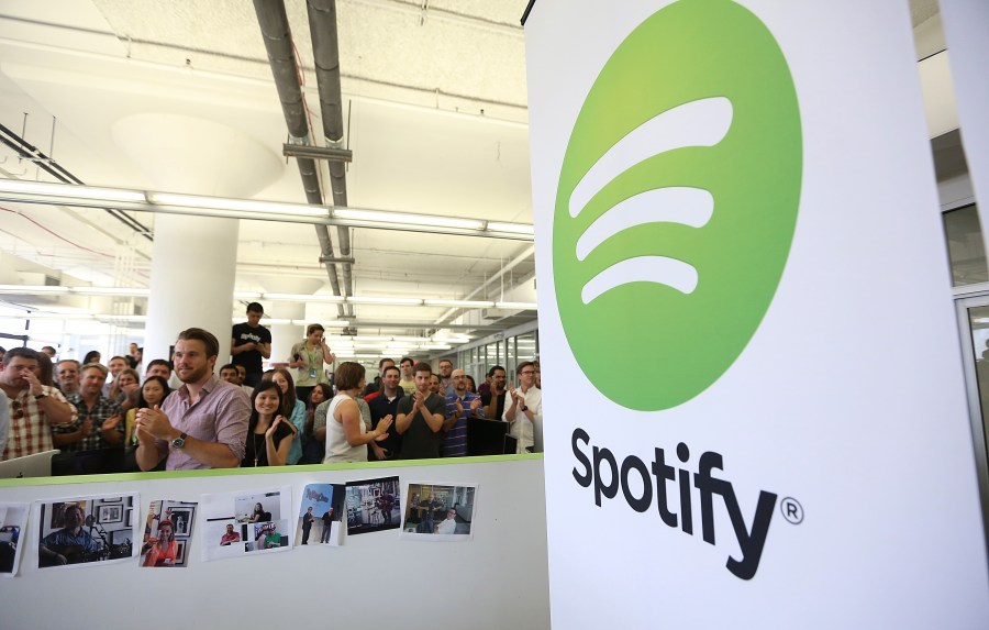 People gather in Spotify offices following a press conference on June 27, 2013 in New York City. (Credit: Mario Tama/Getty Images)