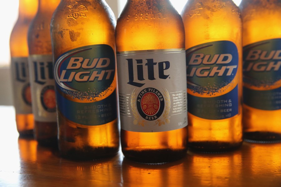 Bud Light and Miller Lite beers are seen in this photo. (Credit: Scott Olson/Getty Images)