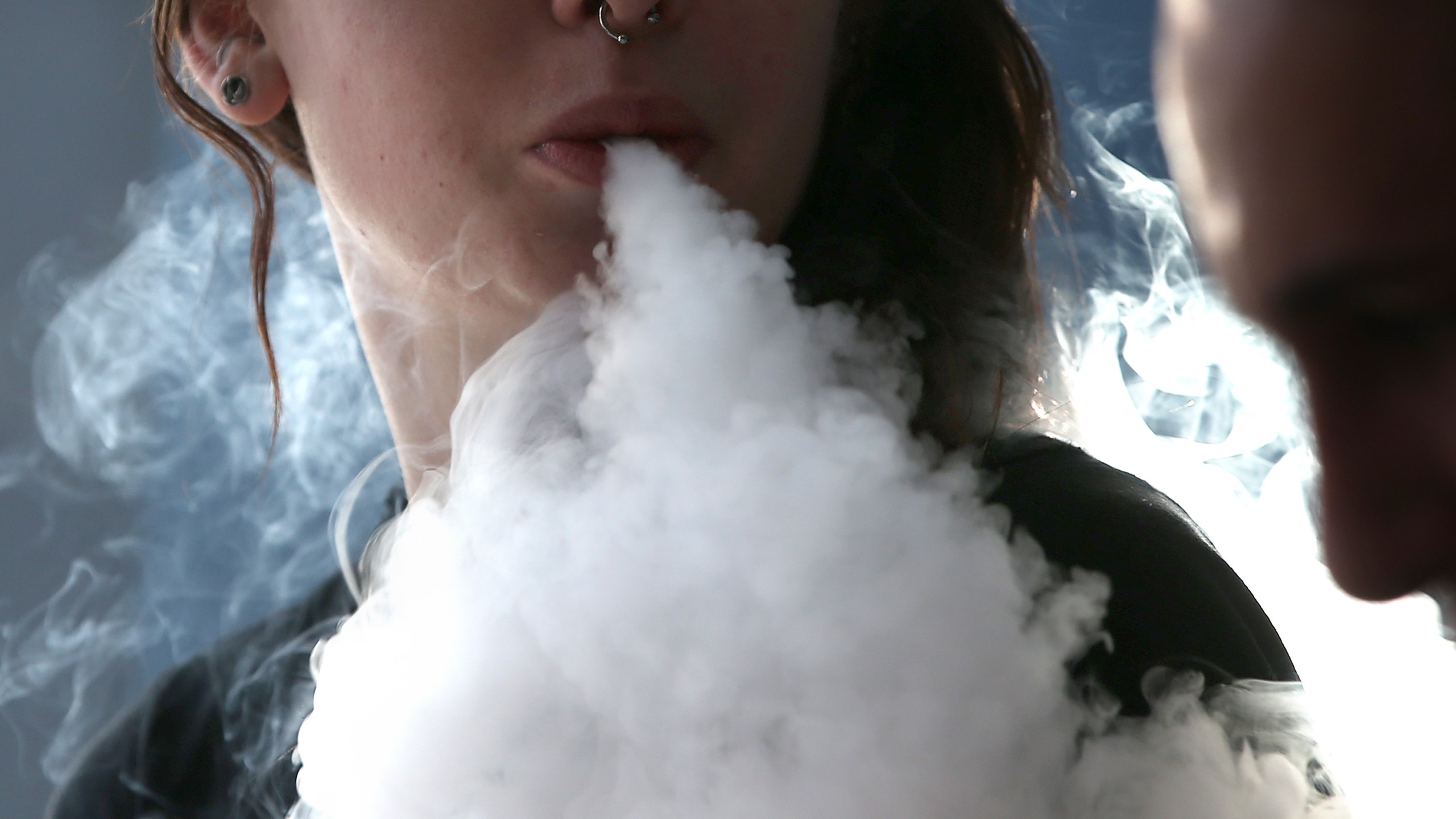 Rhiannon Griffith-Bowman smokes an e-cigarette at Digital Ciggz on Jan. 28, 2015, in San Rafael, Calif. (Credit: Justin Sullivan/Getty Images)