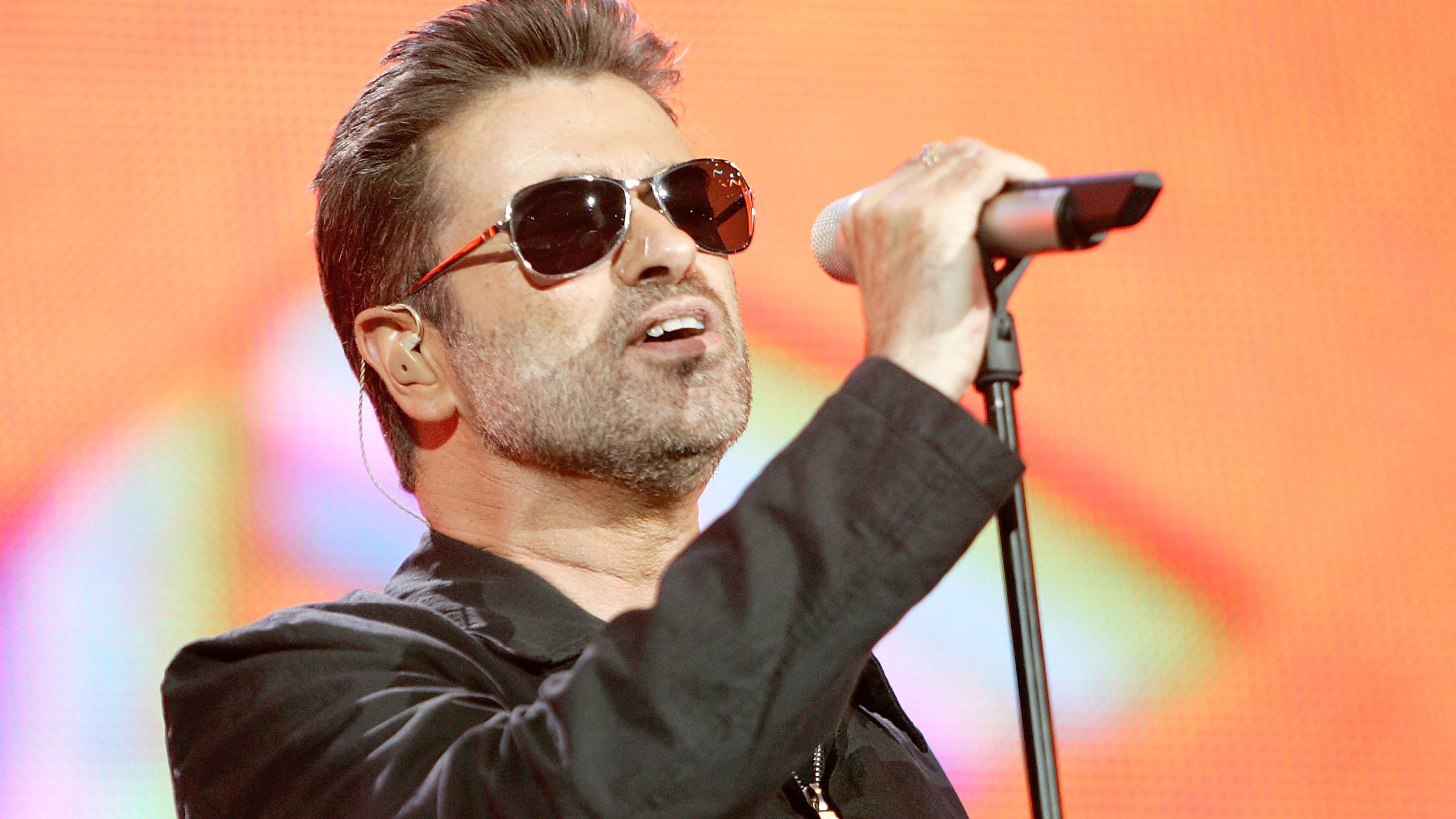 Singer George Michael performs on stage at 'Live 8 London' in Hyde Park on July 2, 2005 in London, England. (Credit: MJ Kim/Getty Images)