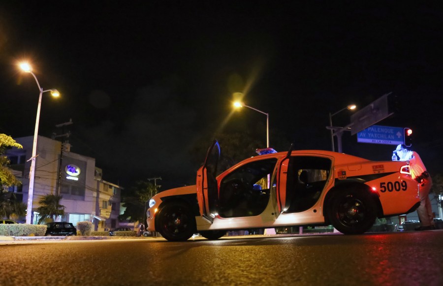 Police patrol cars after a shooting that erupted in Cancun, Mexico, on Jan. 17, 2017. (Credit: ERICK GRAJALES/AFP/Getty Images)