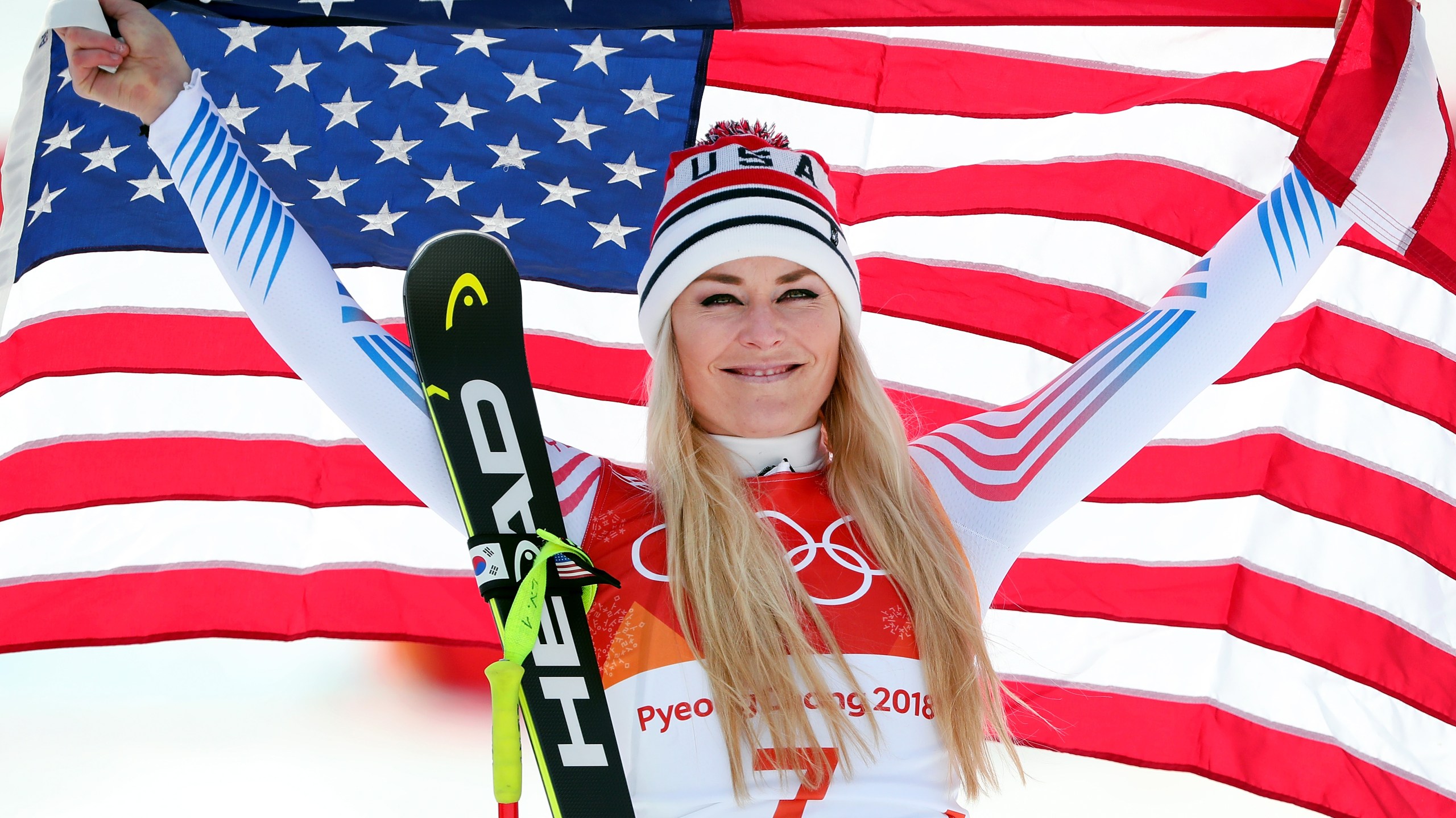 Bronze medallist Lindsey Vonn of the United States celebrates during the victory ceremony for the Ladies' Downhill on day 12 of the PyeongChang 2018 Winter Olympic Games at Jeongseon Alpine Centre on February 21, 2018 in Pyeongchang-gun, South Korea. (Credit: Tom Pennington/Getty Images)