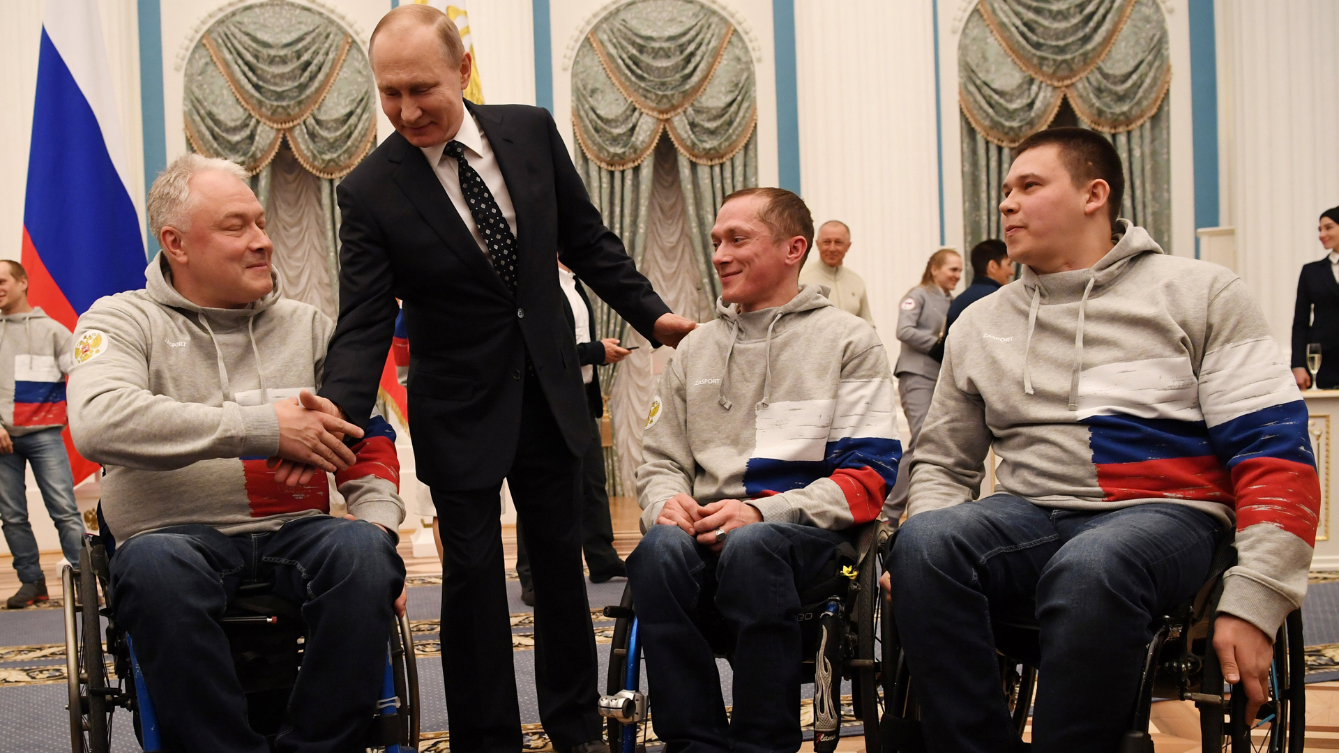 Russian President Vladimir Putin speaks with medalists of the 2018 Pyeongchang Winter Paralympic Games after an award ceremony at the Kremlin in Moscow on March 20, 2018. (Credit: Yuri Kadobnov/AFP/Getty Images)