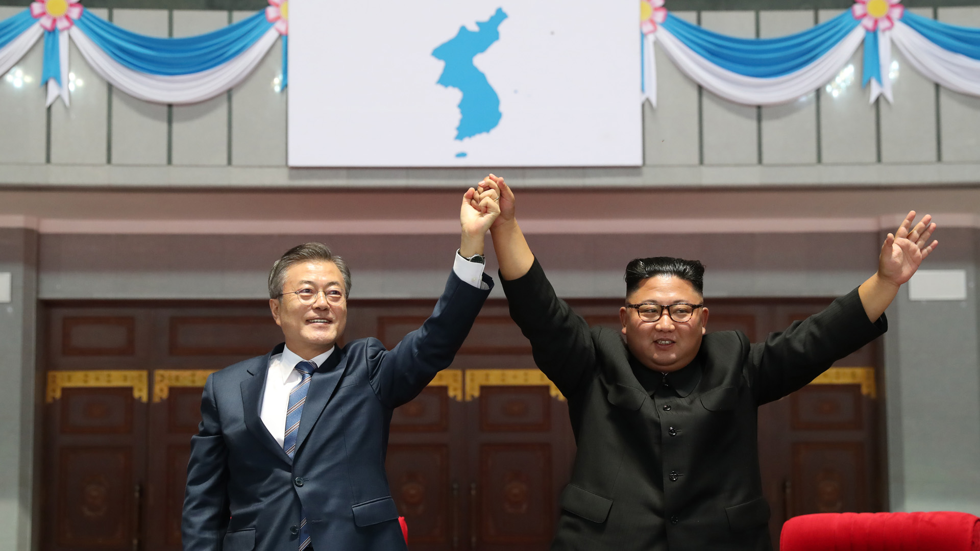 North Korean leader Kim Jong Un (R) and South Korean President Moon Jae-in (L) gesture as they watch the gymnastic and artistic performance at the May Day Stadium on September 19, 2018 in Pyongyang, North Korea. (Credit: Pyeongyang Press Corps/Pool/Getty Images)