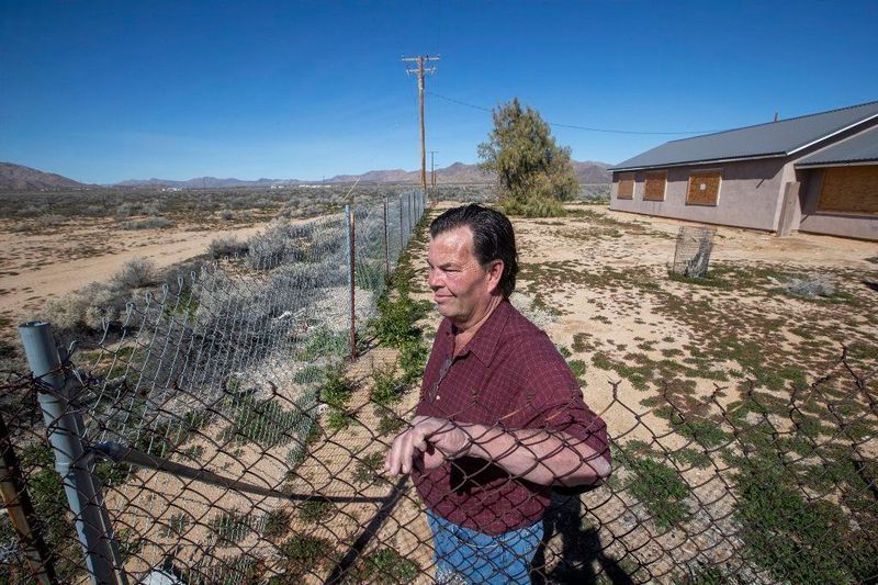 Brian Hammer at his 14-acre property in Lucerne Valley, where he and his wife hope to retire, on Feb. 25, 2019. (Credit: Allen J. Schaben / Los Angeles Times)