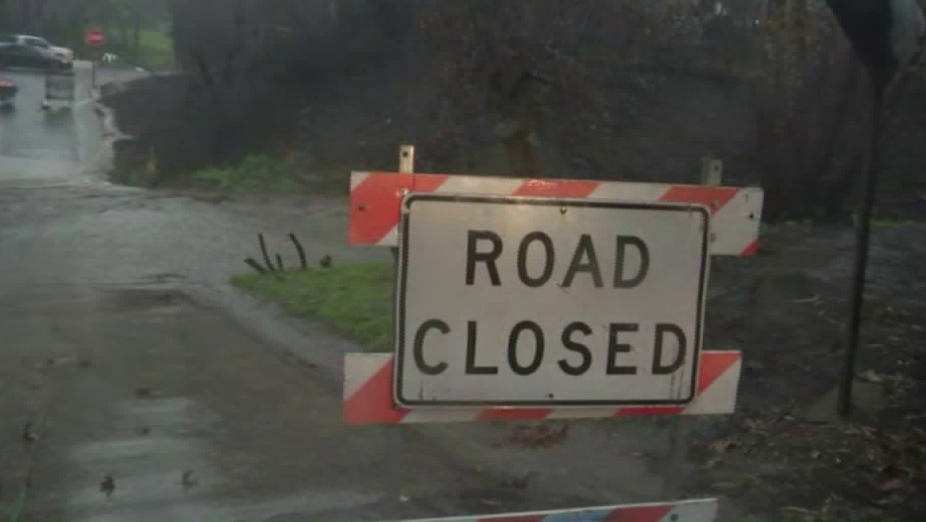 A road closure sign is seen amid heavy rain in Malibu on Feb. 2, 2019. (Credit: KTLA)