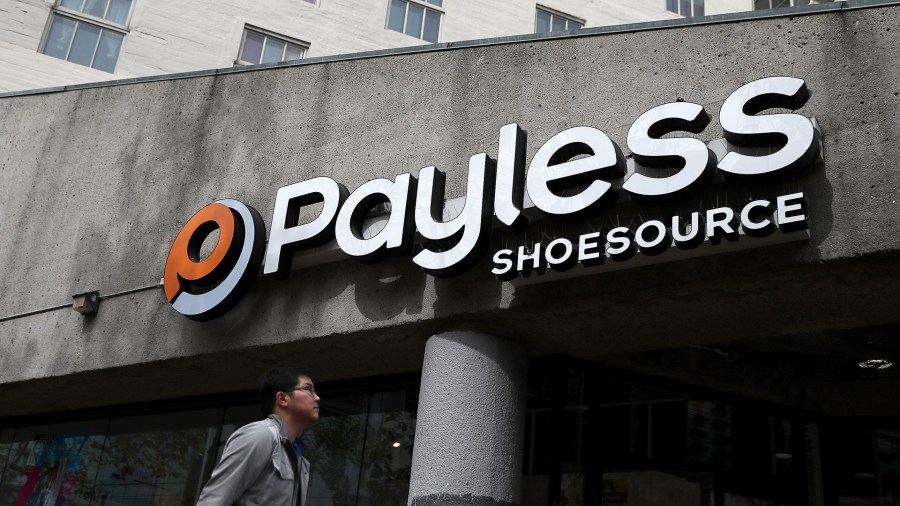 A pedestrian walks by a Payless Shoe Source store on April 5, 2017 in San Francisco. (Credit: Justin Sullivan/Getty Images)