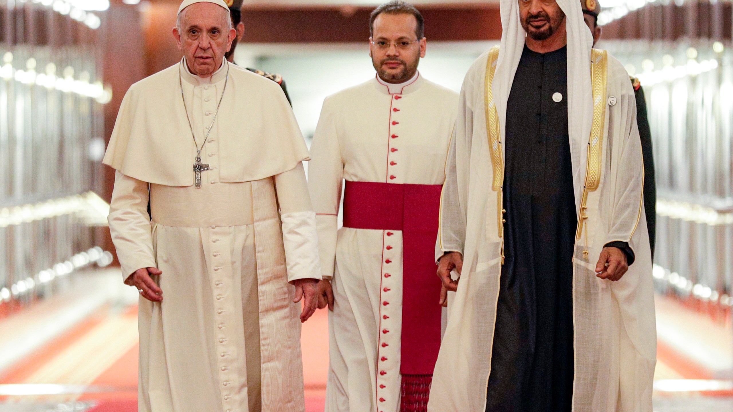 Pope Francis (C-L) is welcomed by Abu Dhabi's Crown Prince Sheikh Mohammed bin Zayed al-Nahyan (C-R) upon his arrival at Abu Dhabi International Airport in the UAE capital on February 3, 2019. (Credit: Andrew Medichini / POOL / AFP/Getty Images)