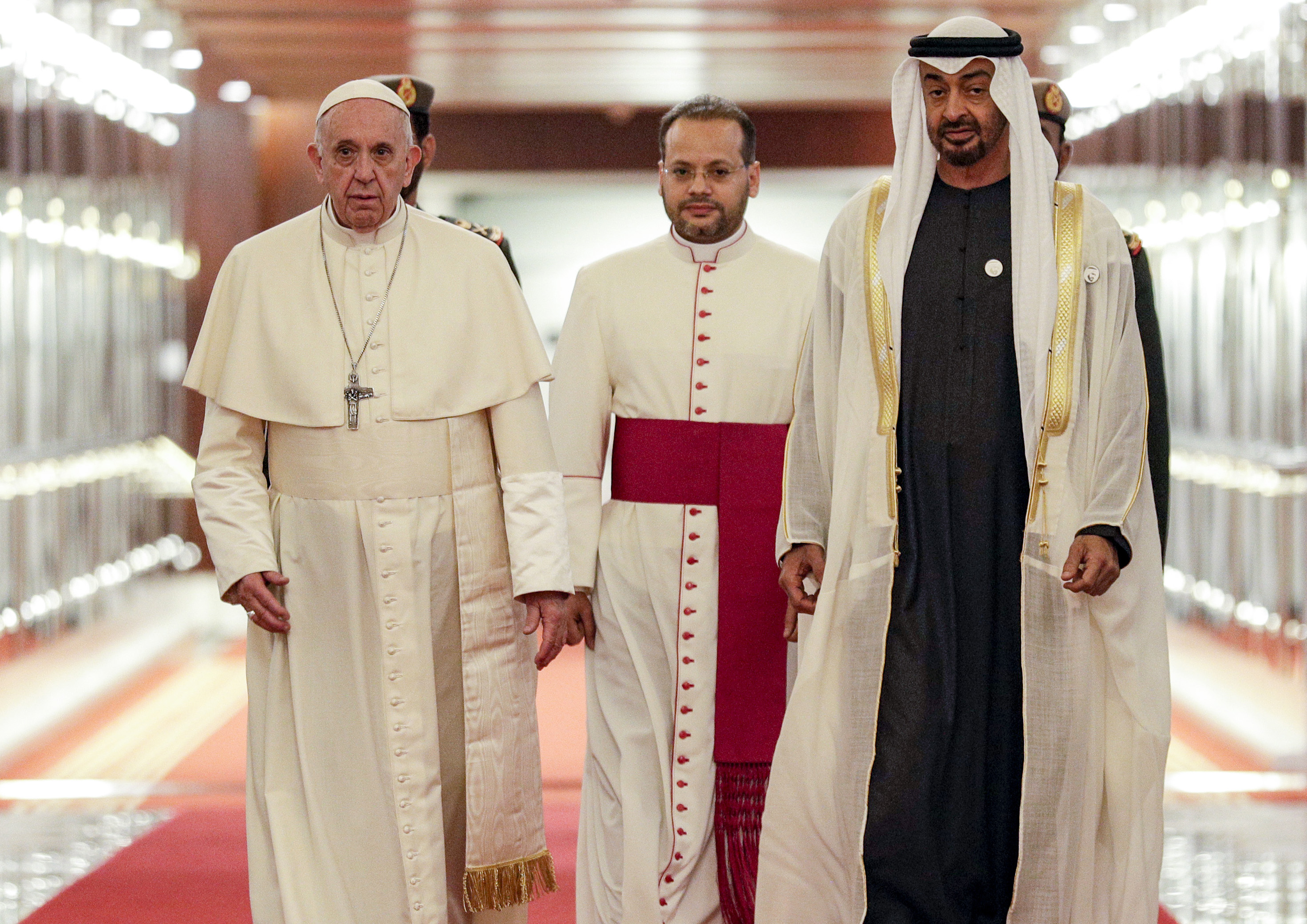 Pope Francis (C-L) is welcomed by Abu Dhabi's Crown Prince Sheikh Mohammed bin Zayed al-Nahyan (C-R) upon his arrival at Abu Dhabi International Airport in the UAE capital on February 3, 2019. (Credit: Andrew Medichini / POOL / AFP/Getty Images)