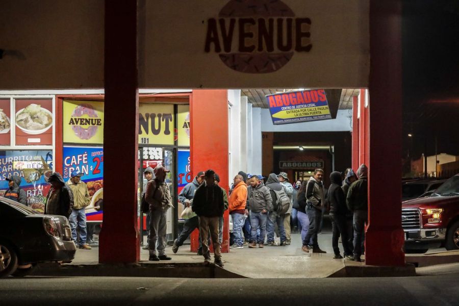 Waiting at a Calexico doughnut shop are farmworkers from Mexico who started crossing the border at around 1 a.m. (Credit: Irfan Khan / Los Angeles Times)