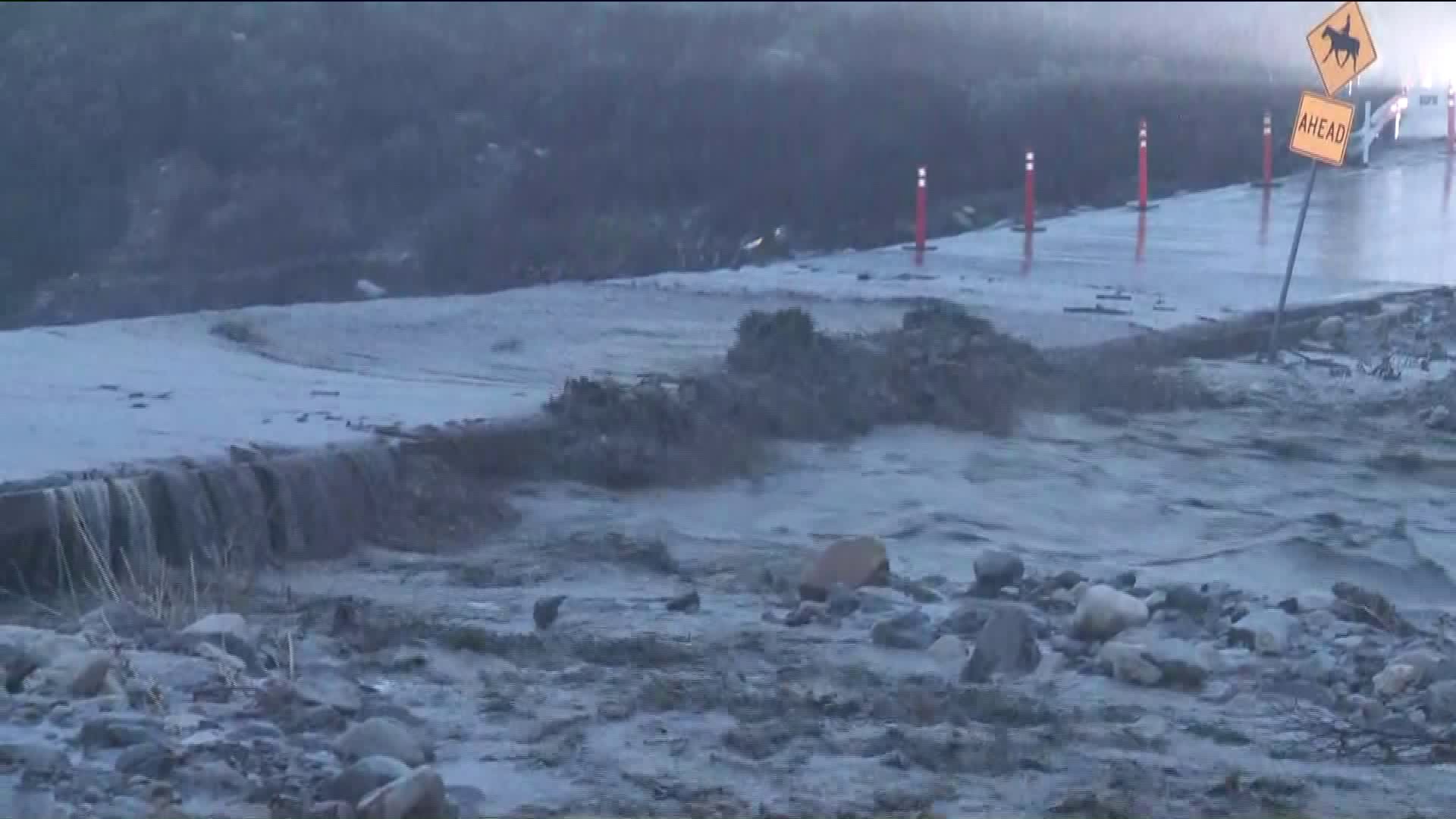 A roadway in Trabuco Canyon is seen flooded. (Credit: KTLA)