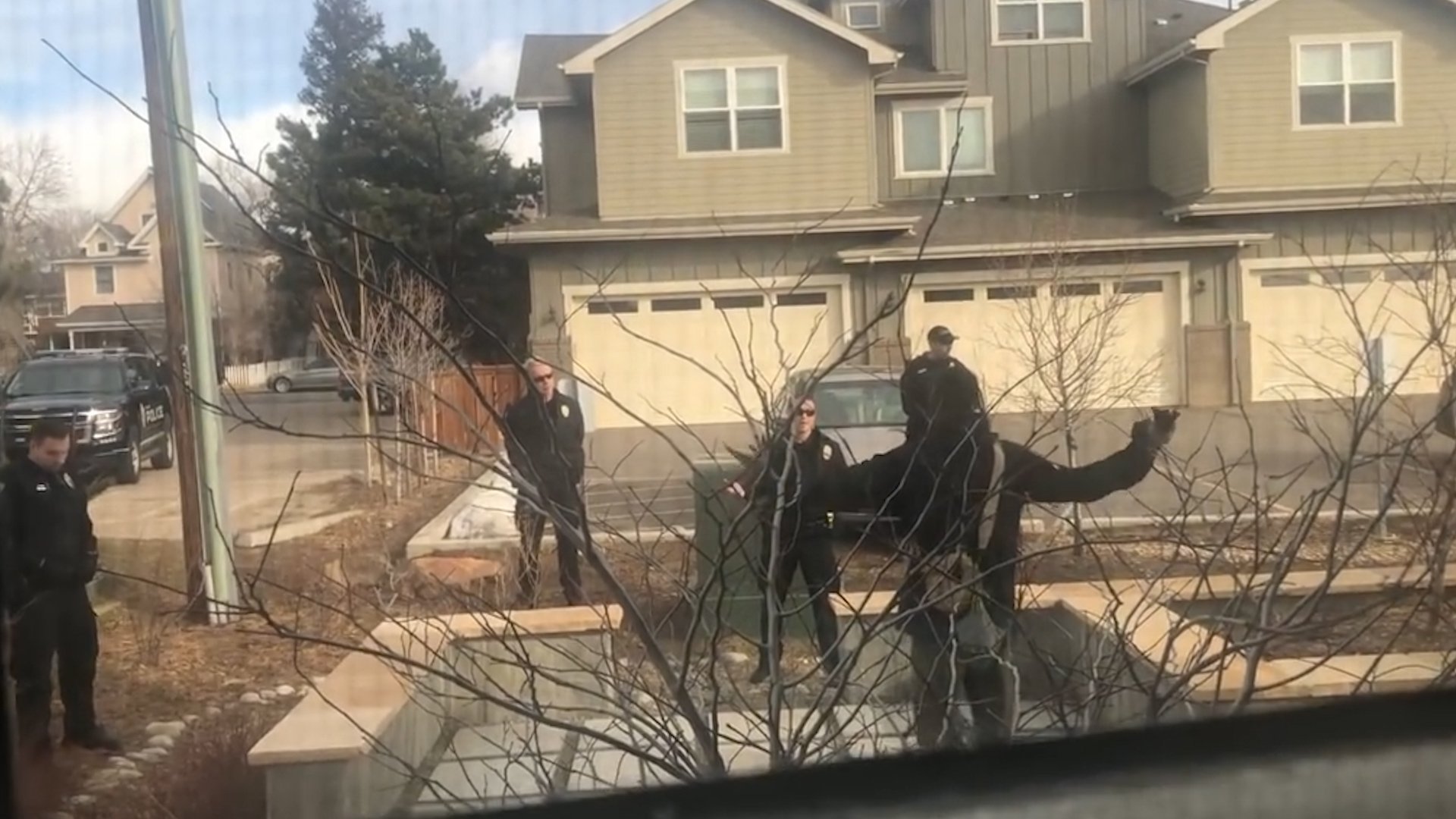 A still from a bystander's video shows Boulder police officers and the man they confronted. (CNN)