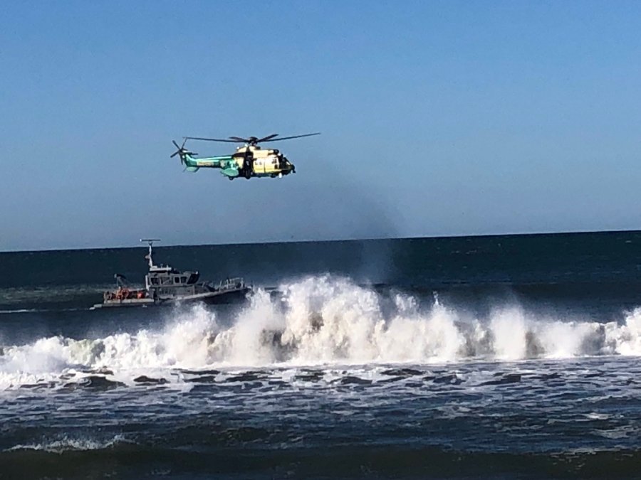 A helicopter crew searches for a missing swimmer near the Santa Monica Pier on March 13, 2019. (Credit: L.A. County Sheriff's Department's Special Enforcement Bureau/Twitter)