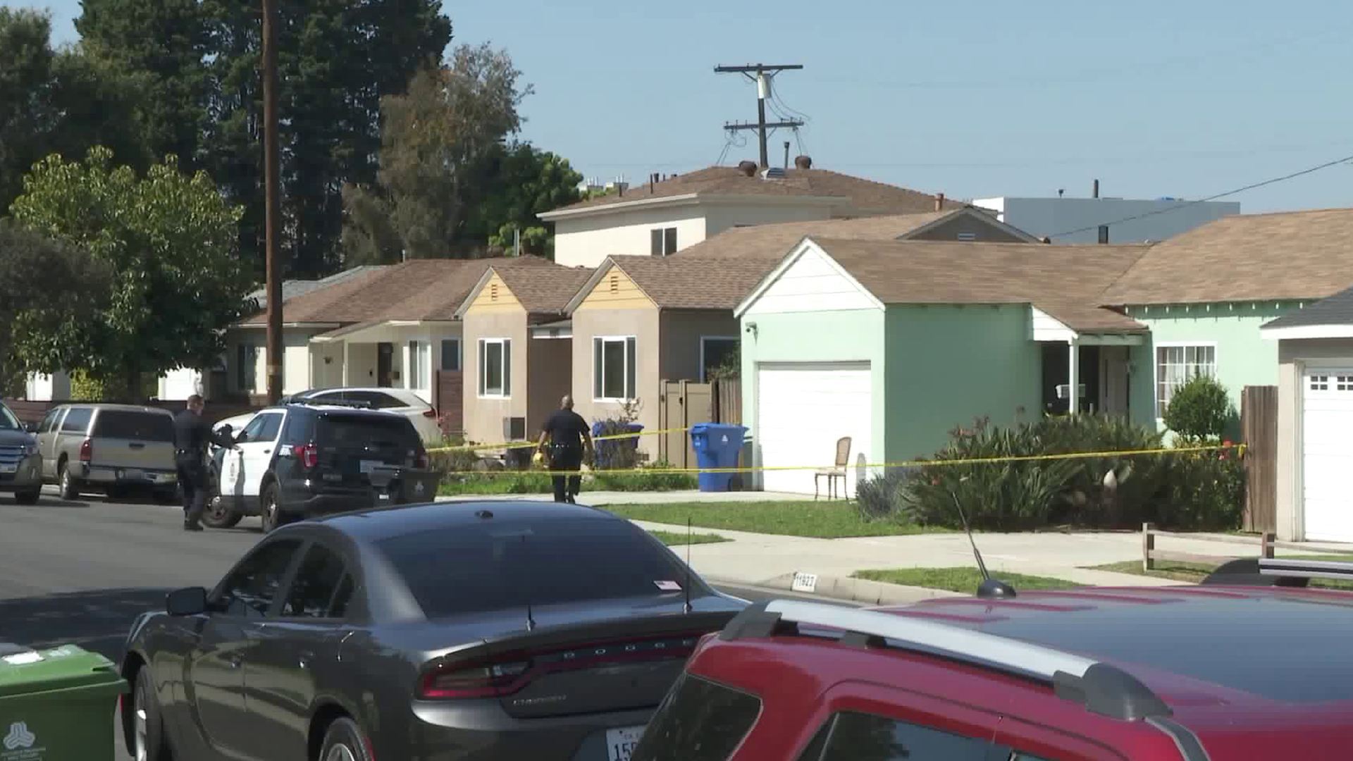 Police investigate at a home in Del Rey after a woman was found fatally burned in a bathtub. (Credit: KTLA)