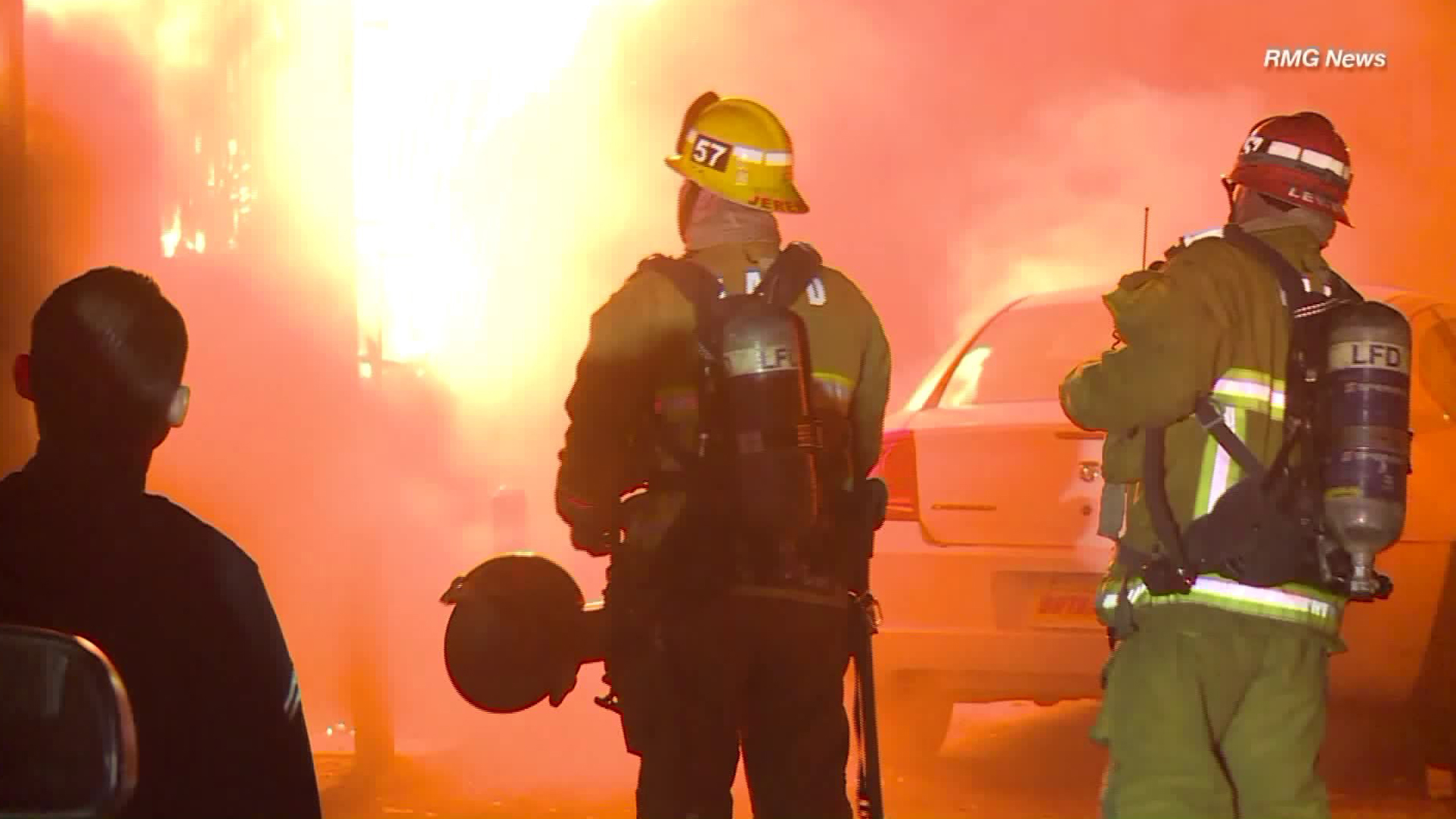 Firefighters battle a blaze at a fourplex in Harvard Park on March 15, 2019. (Credit: RMG News)