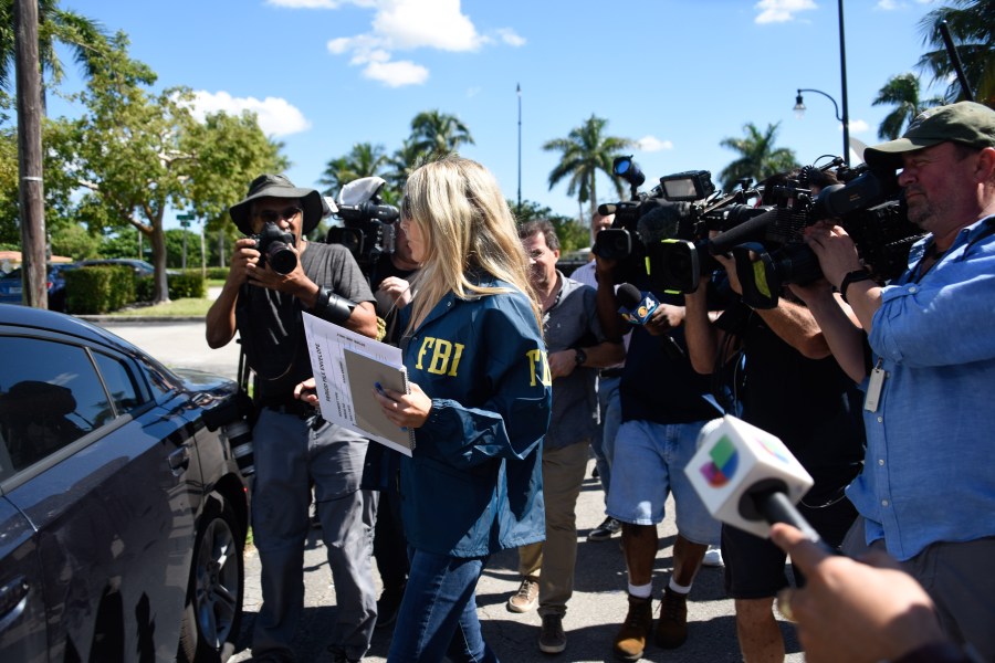 An FBI agent leaves the Auto Zone store in Plantation, north of Miami, on Oct. 26, 2018, where Cesar Sayoc was arrested in connection with 12 pipe bombs and suspicious packages recently mailed to top Democrats. (Credit: MICHELE EVE SANDBERG/AFP/Getty Images)