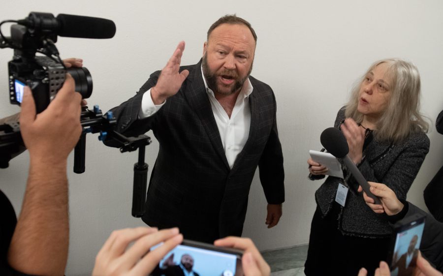 Conservative commentator Alex Jones speaks outside the hearing room prior to testimony by Google CEO Sundar Pichai during a House Judiciary Committee hearing on Capitol Hill, Dec. 11, 2018. (Credit: Saul Loeb / AFP / Getty Images)