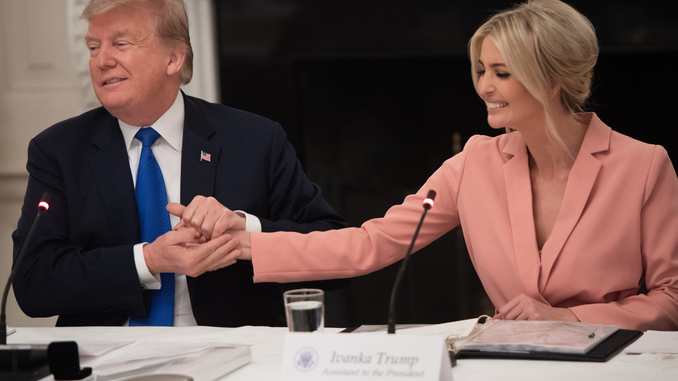 US President Donald Trump speaks alongside senior advisor and daughter Ivanka Trump (R) during the first meeting of the American Workforce Policy Advisory Board in the State Dining Room of the White House in Washington, DC, March 6, 2019. (Credit: SAUL LOEB/AFP/Getty Images)