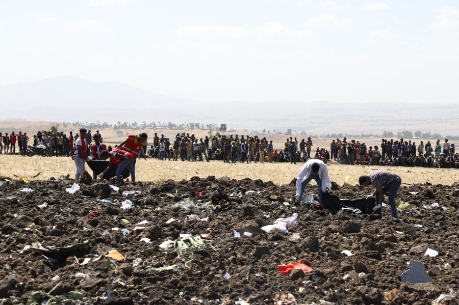 Rescue team collect remains of bodies amid debris at the crash site of Ethiopia Airlines near Bishoftu, Ethiopia, on March 10, 2019. -(Credit: MICHAEL TEWELDE/AFP/Getty Images)