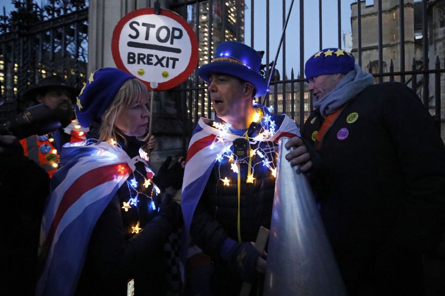 Anti-Brexit activist Steve Bray, center, and supporters protest outside the Houses of Parliament in London on March 12, 2019. (Credit: TOLGA AKMEN/AFP/Getty Images)