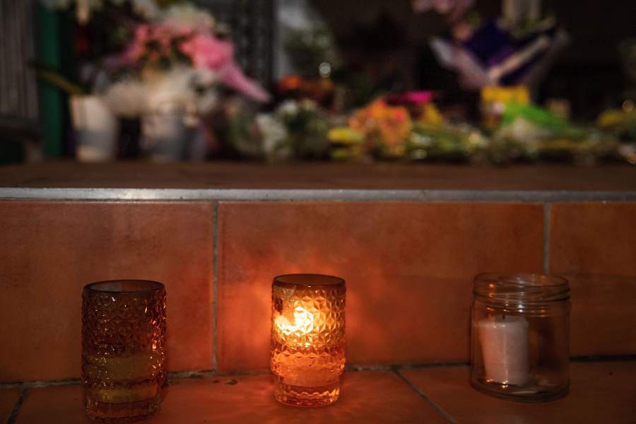 Flowers and candles are placed on the front steps of the Wellington Masjid mosque in Kilbirnie in Wellington on March 15, 2019, after a shooting incident at two mosques in Christchurch. (Credit: MARTY MELVILLE/AFP/Getty Images)