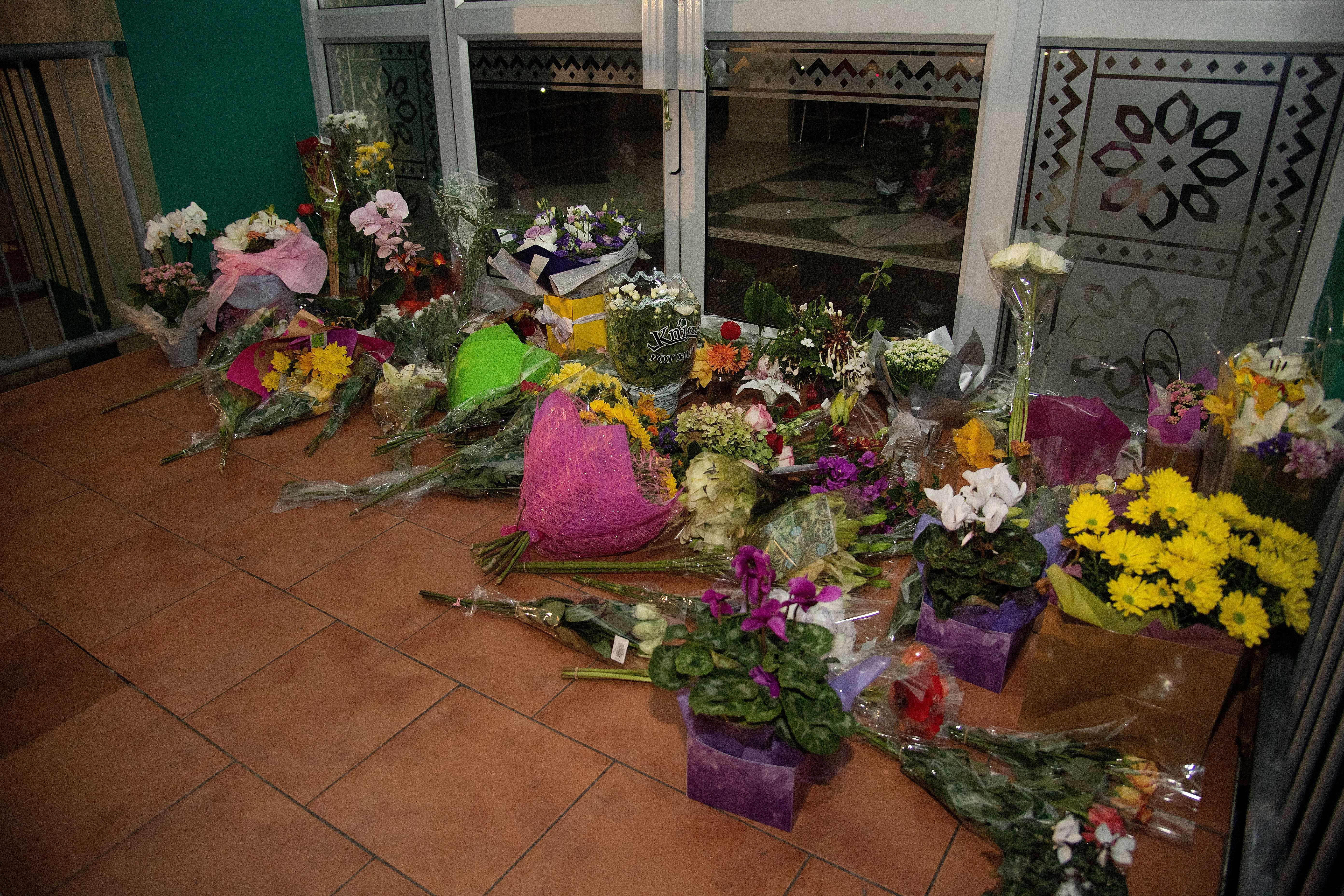 Flowers are placed on the front steps of the Wellington Masjid mosque in Kilbirnie in Wellington on March 15, 2019, after a shooting incident at two mosques in Christchurch. (Credit: MARTY MELVILLE/AFP/Getty Images)