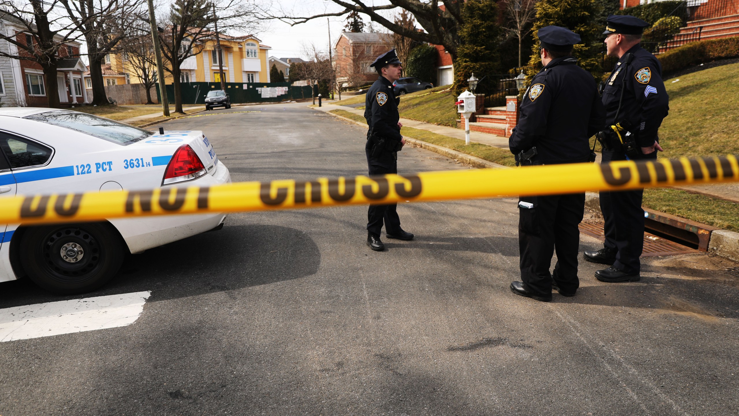 Police stand near where reputed mob boss Francesco “Franky Boy” Cali lived and was gunned down on March 14, 2019, in New York City. (Credit: Spencer Platt/Getty Images)