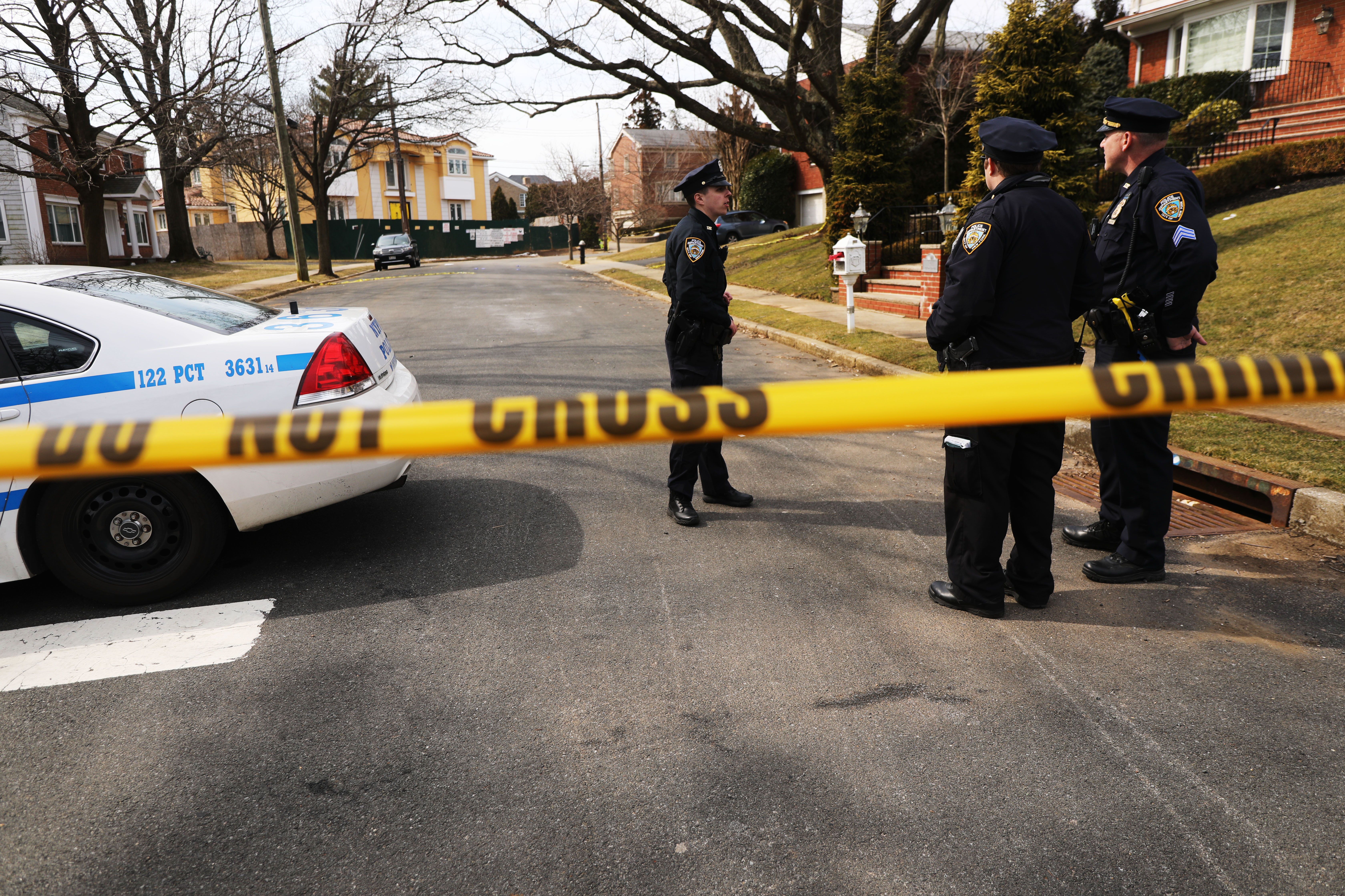 Police stand near where reputed mob boss Francesco “Franky Boy” Cali lived and was gunned down on March 14, 2019, in New York City. (Credit: Spencer Platt/Getty Images)