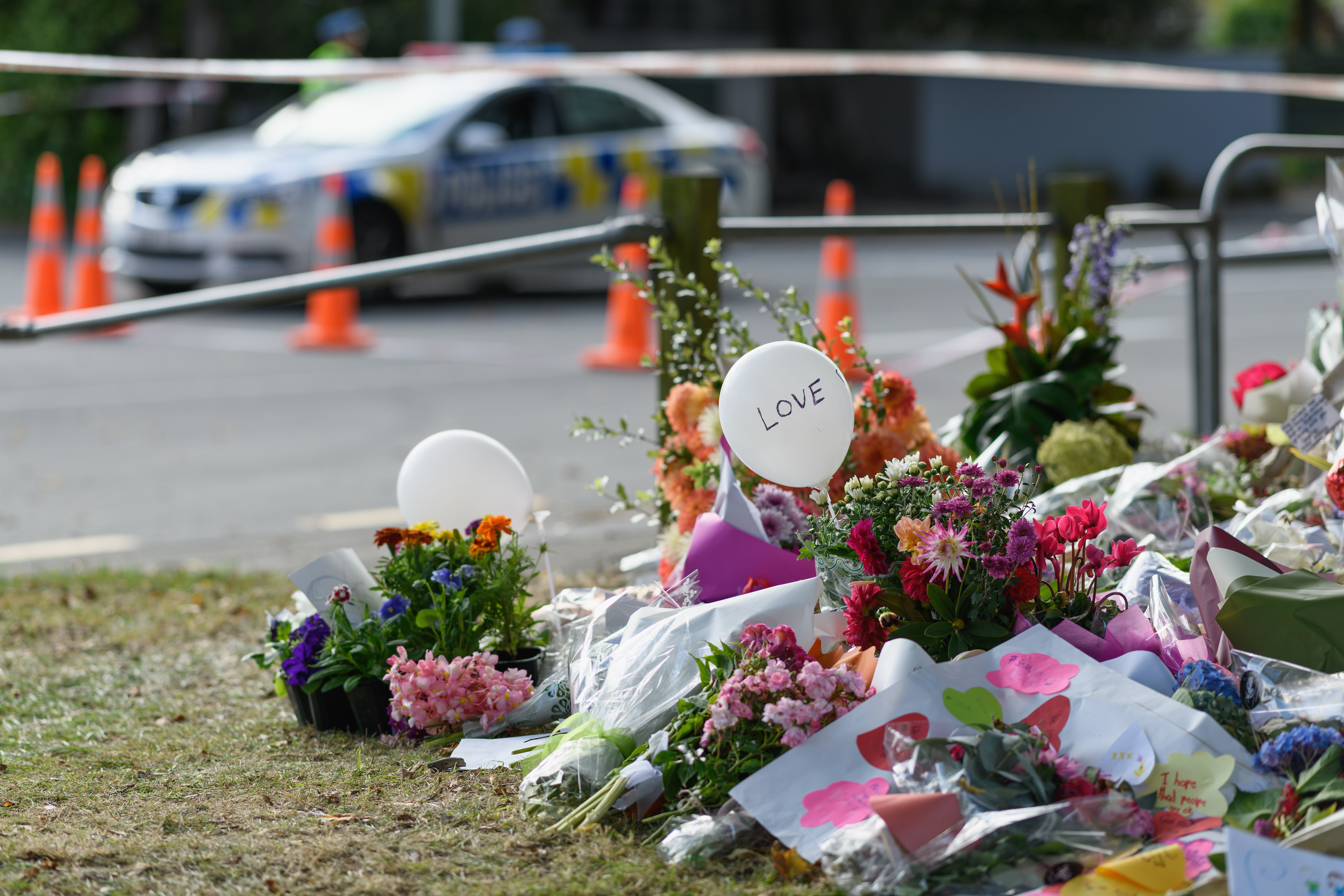 Flowers and condolences are seen in front of Al Noor mosque on March 20, 2019 in Christchurch, New Zealand. 50 people were killed, and dozens are still injured in hospital after a gunman opened fire on two Christchurch mosques on Friday, 15 March. The accused attacker, 28-year-old Australian, Brenton Tarrant, has been charged with murder and remanded in custody until April 5. The attack is the worst mass shooting in New Zealand's history. (Credit: Kai Schwoerer/Getty Images)