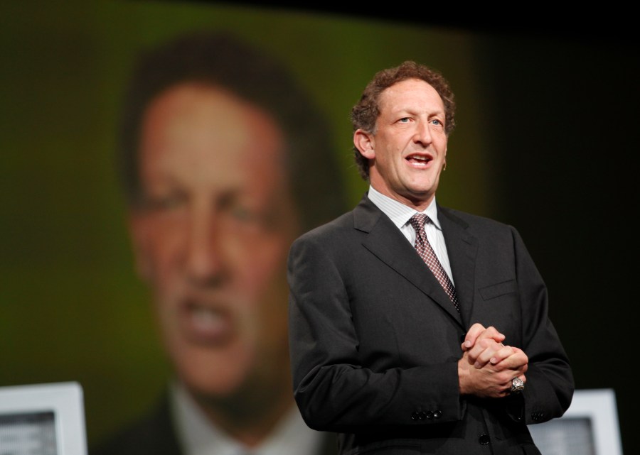 San Francisco Giants President Larry Baer appears to the stage to award Oracle CEO Larry Ellison the 2010 World Series ring at the Moscone Center in San Francisco during the Oracle OpenWorld 2011 on October 2, 2011. (Credit: KIMIHIRO HOSHINO/AFP/Getty Images)